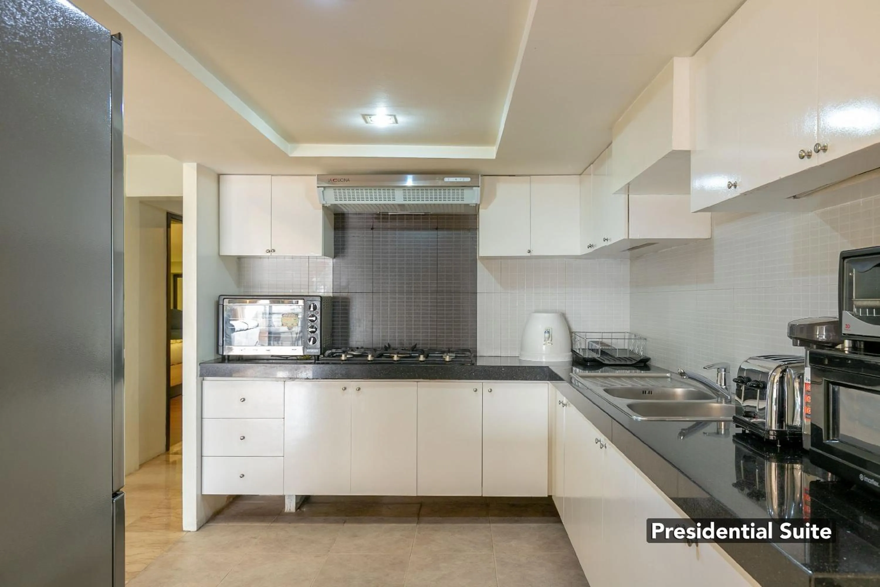Kitchen or kitchenette in Orchid Garden Suites