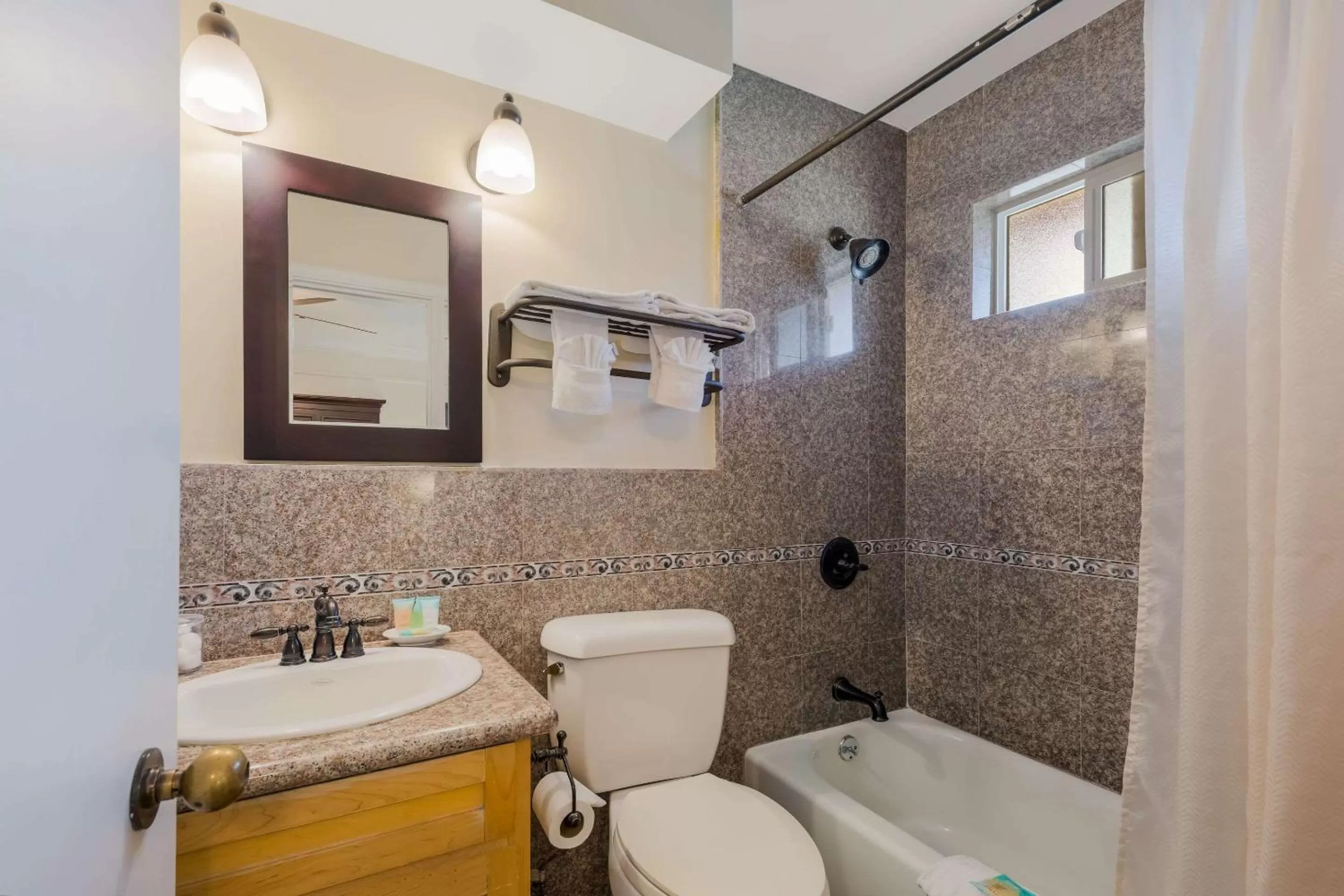 Shower in Clarion Collection Carmel Oaks Inn