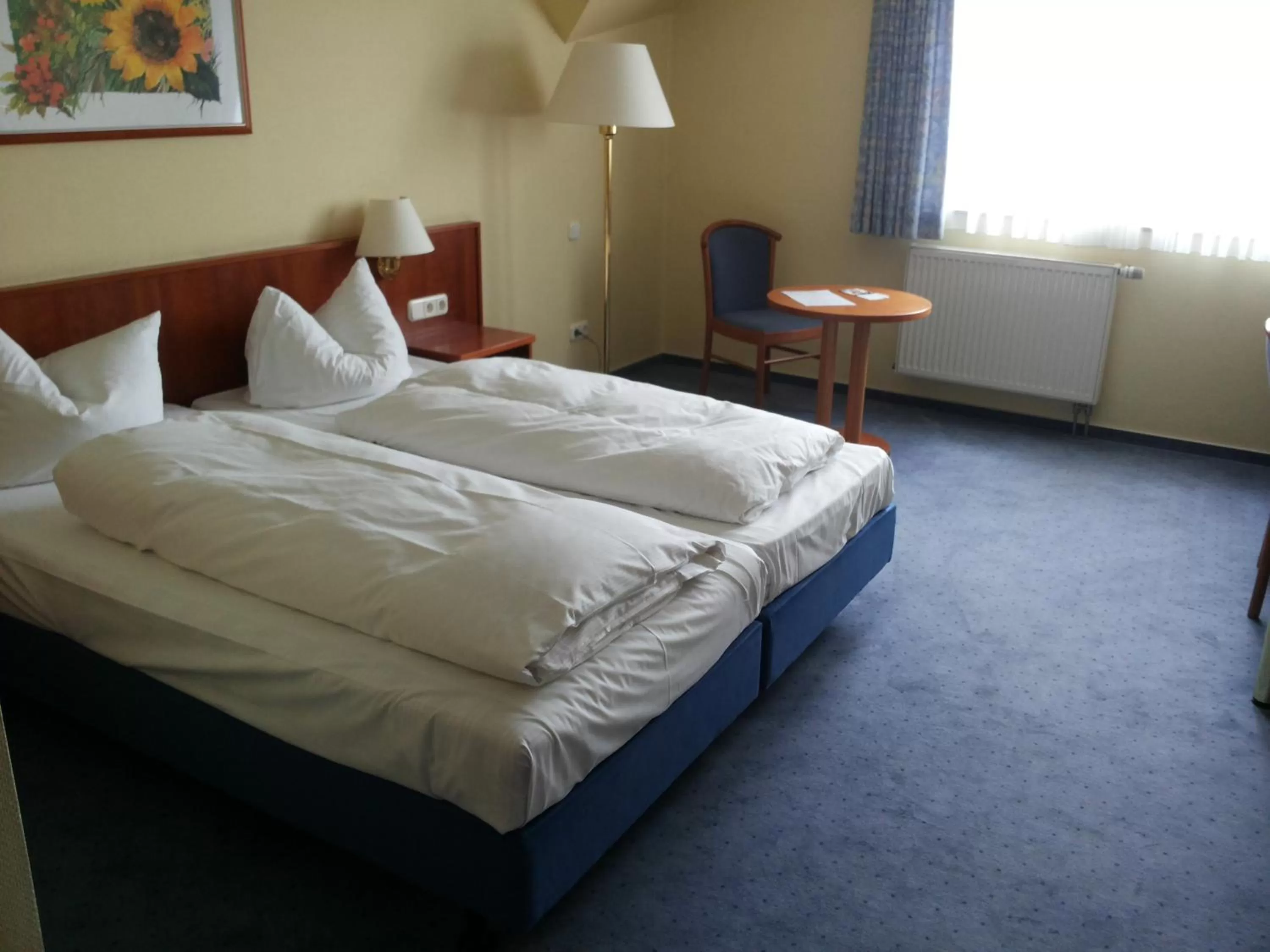 Photo of the whole room, Bed in Hotel Mühlenhof Lollar