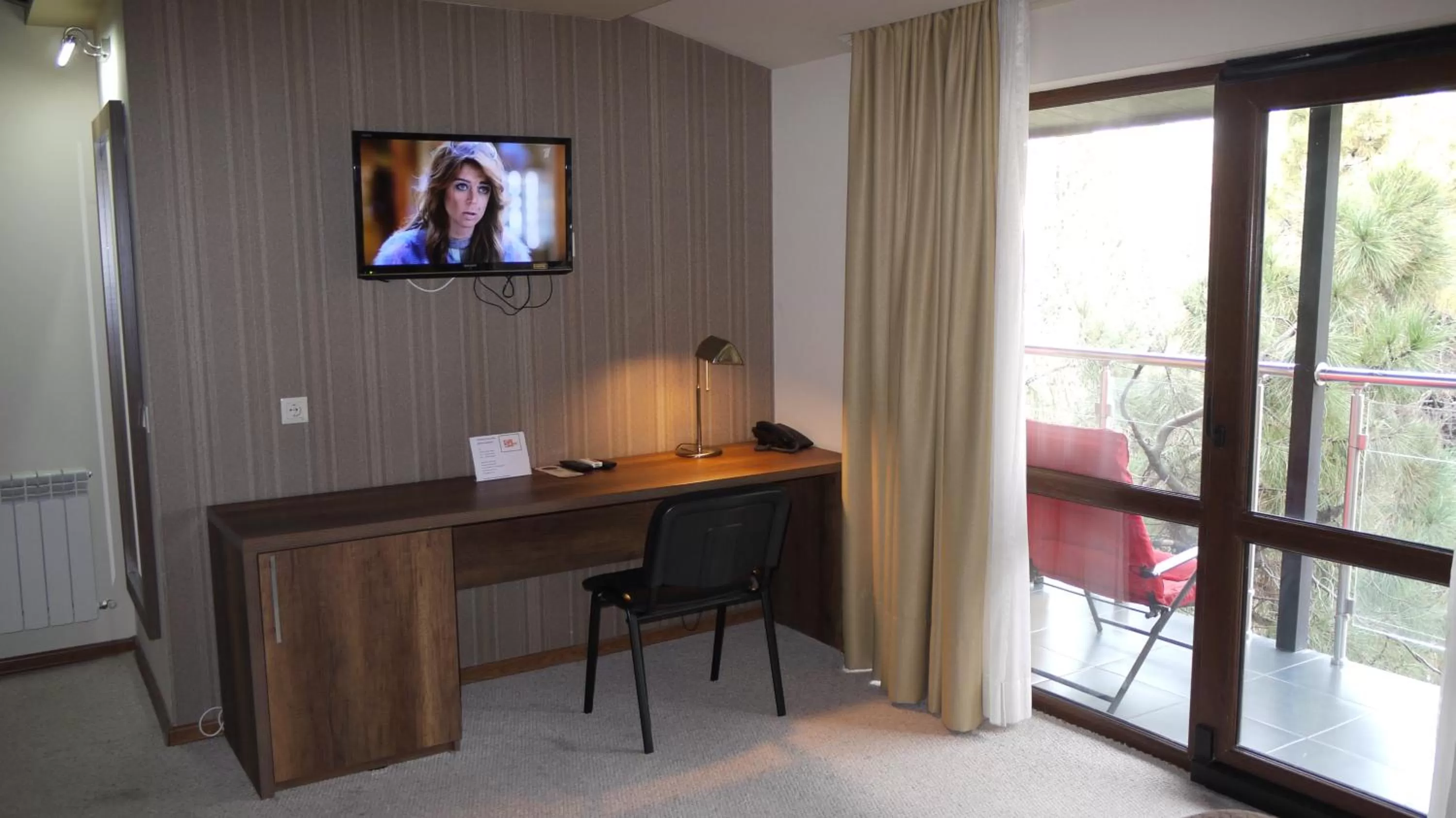 Photo of the whole room, TV/Entertainment Center in Sani Hotel