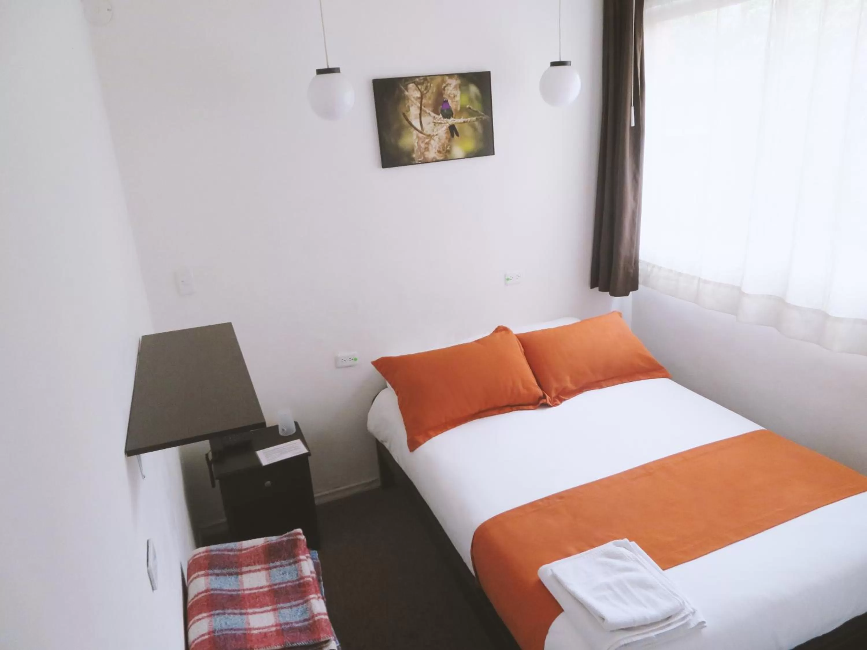 Bed in Bird Garden Guest House