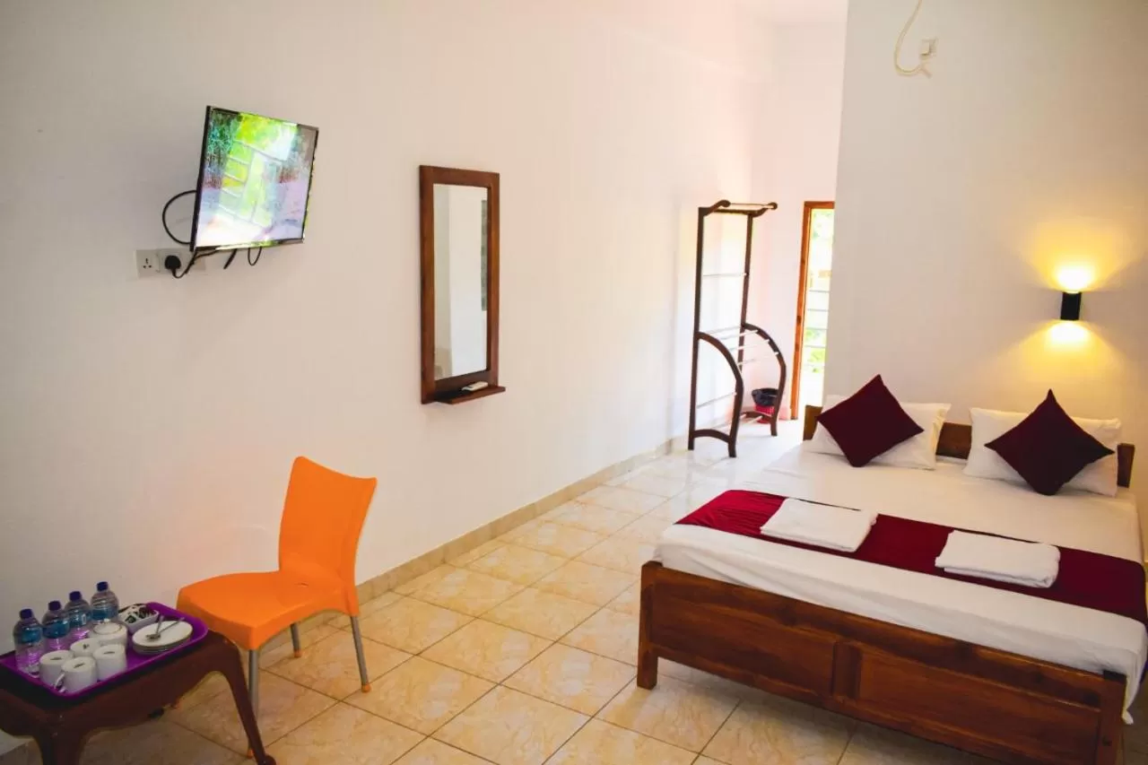 Bed in Hotel Theevanni Inn