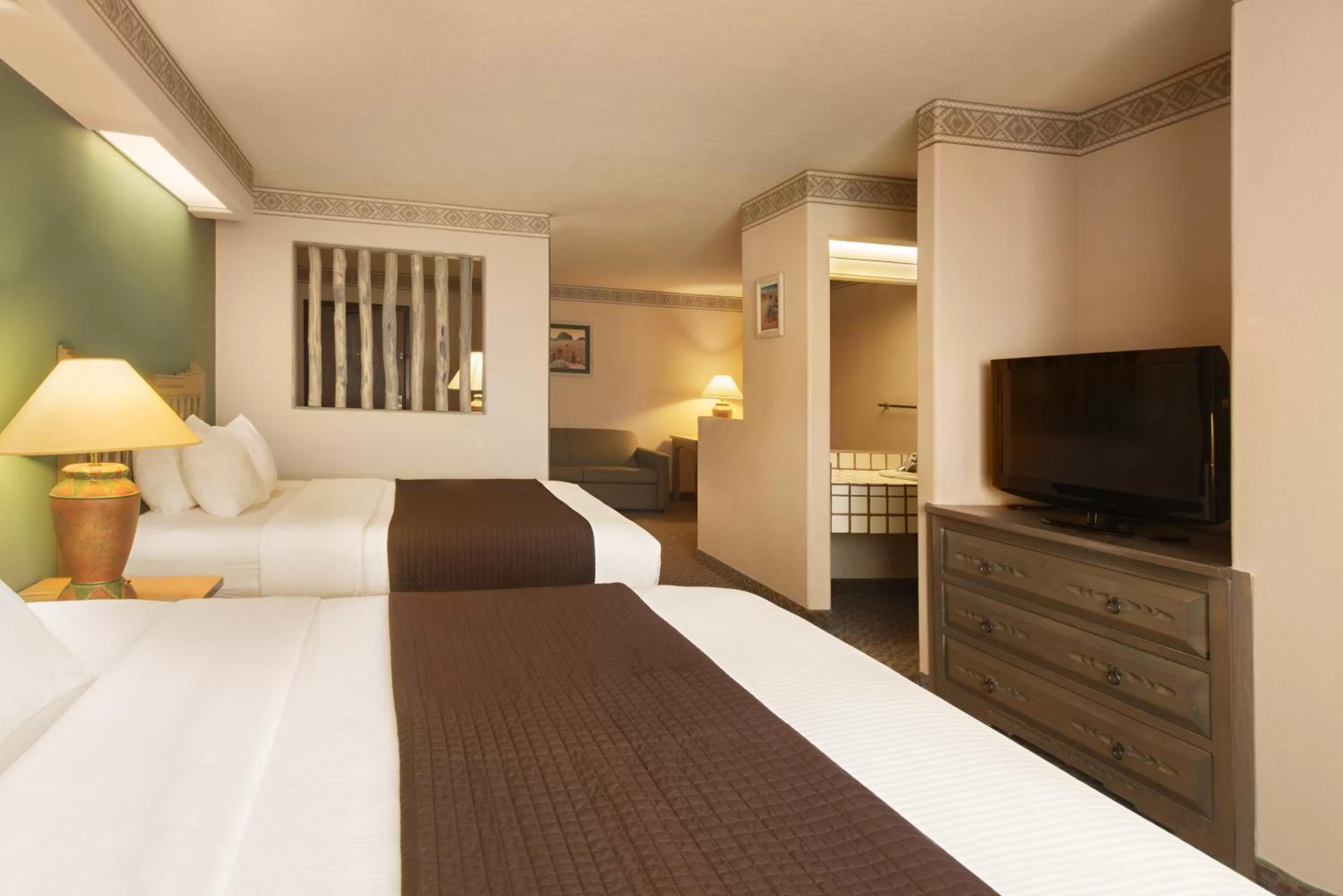 Bed in Sagebrush Inn & Suites