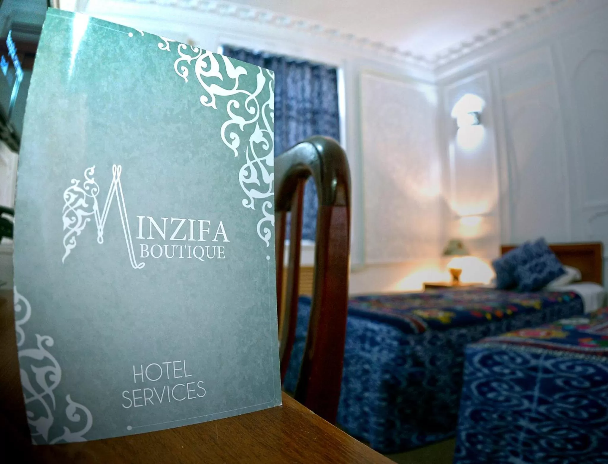 Property logo or sign, Bed in Minzifa Inn