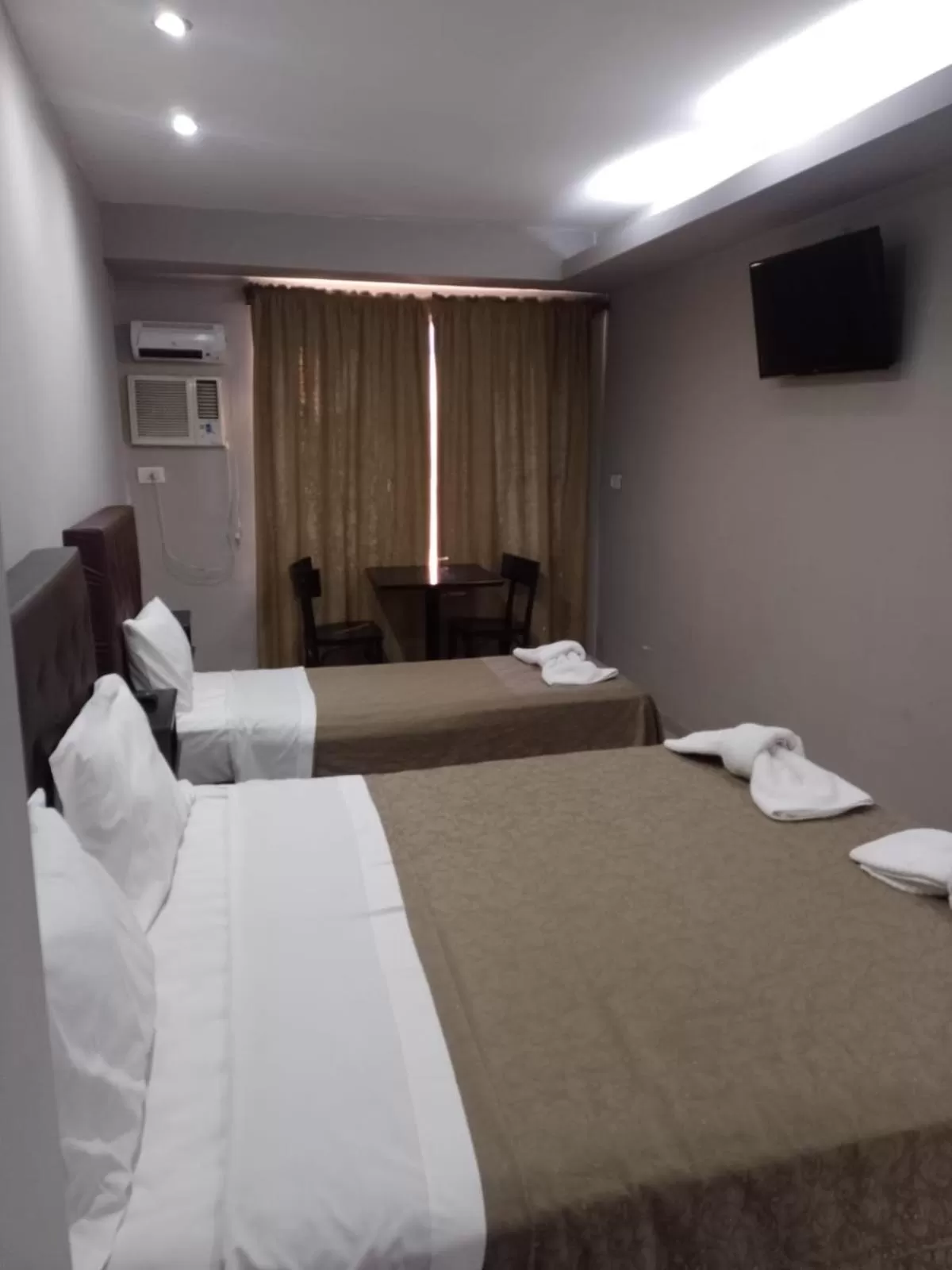 Bed in Lorenzo Suites Hotel