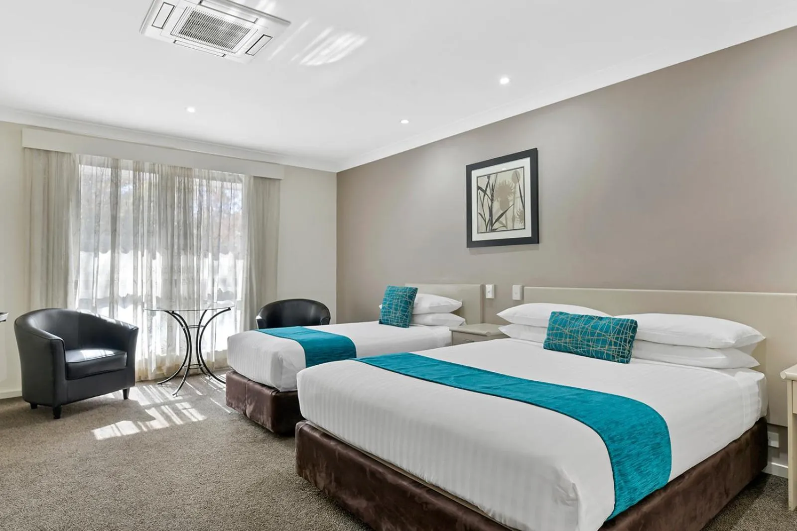 Bed in Central Caleula Motor Lodge