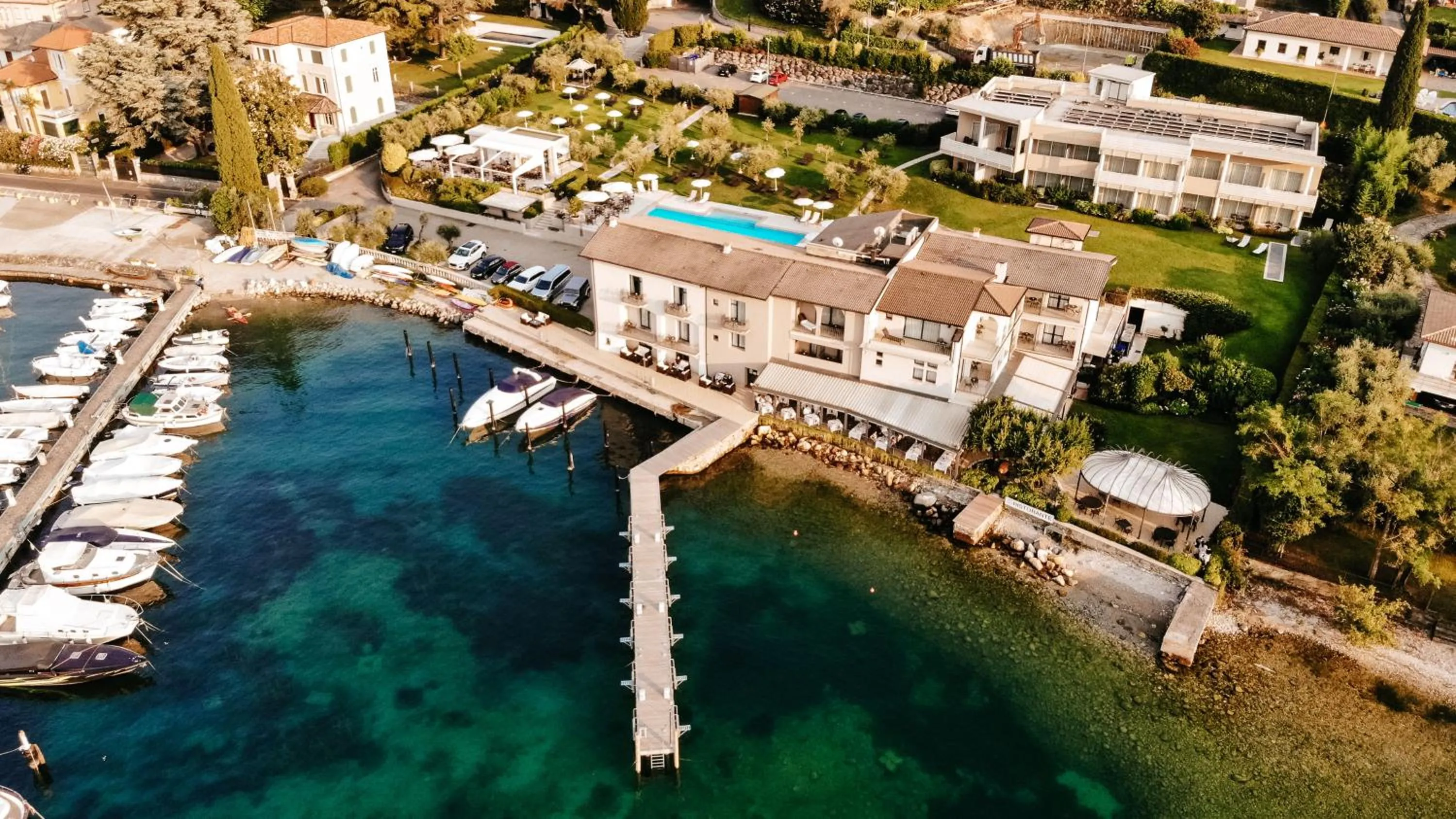 Property building in Bella Hotel & Restaurant with private dock for mooring boats