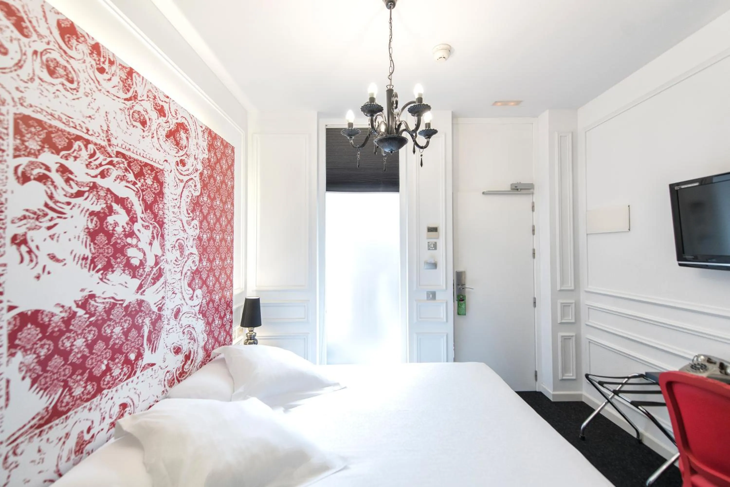 Bed in Posada del Dragón Boutique Hotel