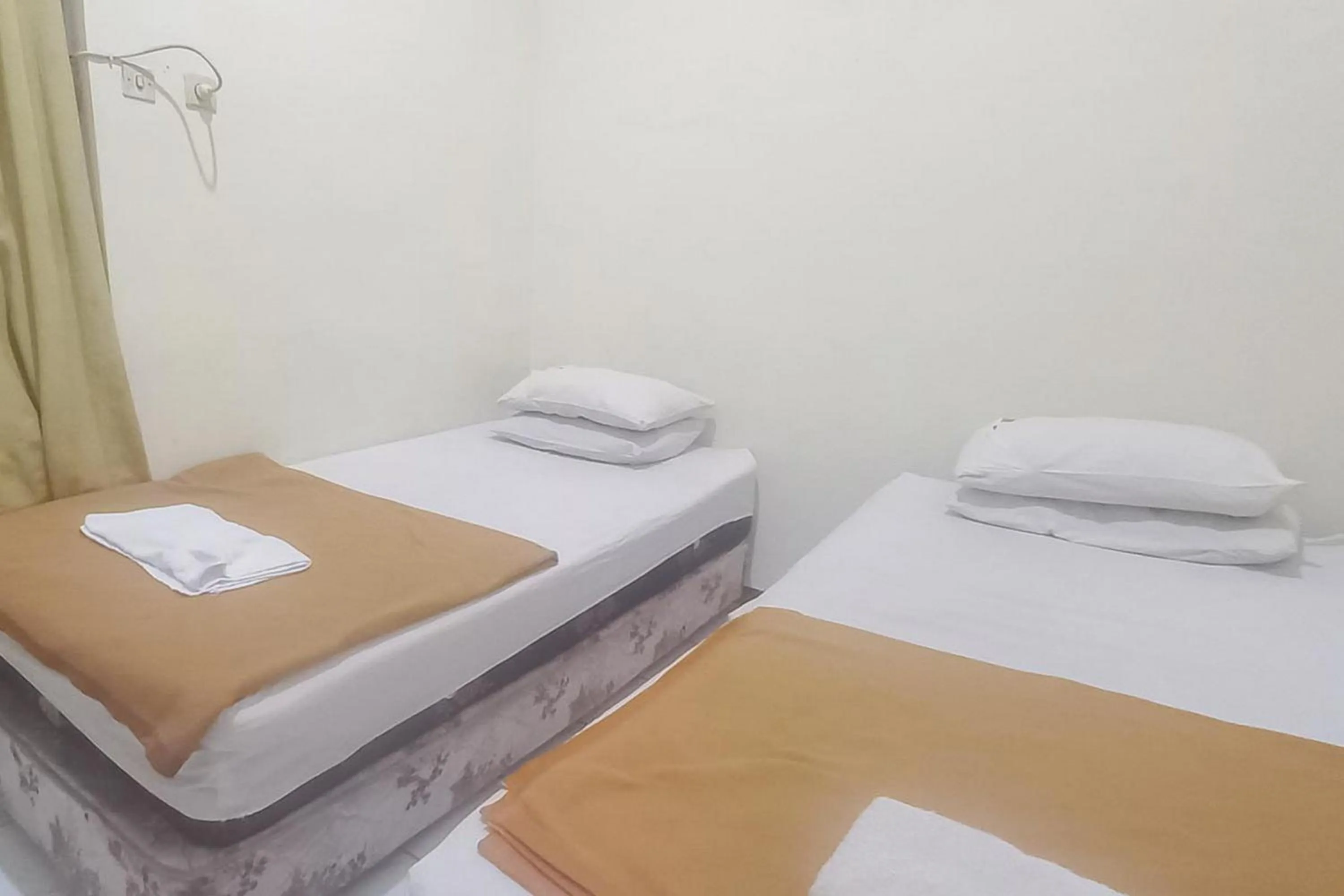 Bed in Hotel Malang near Alun Alun Malang RedPartner