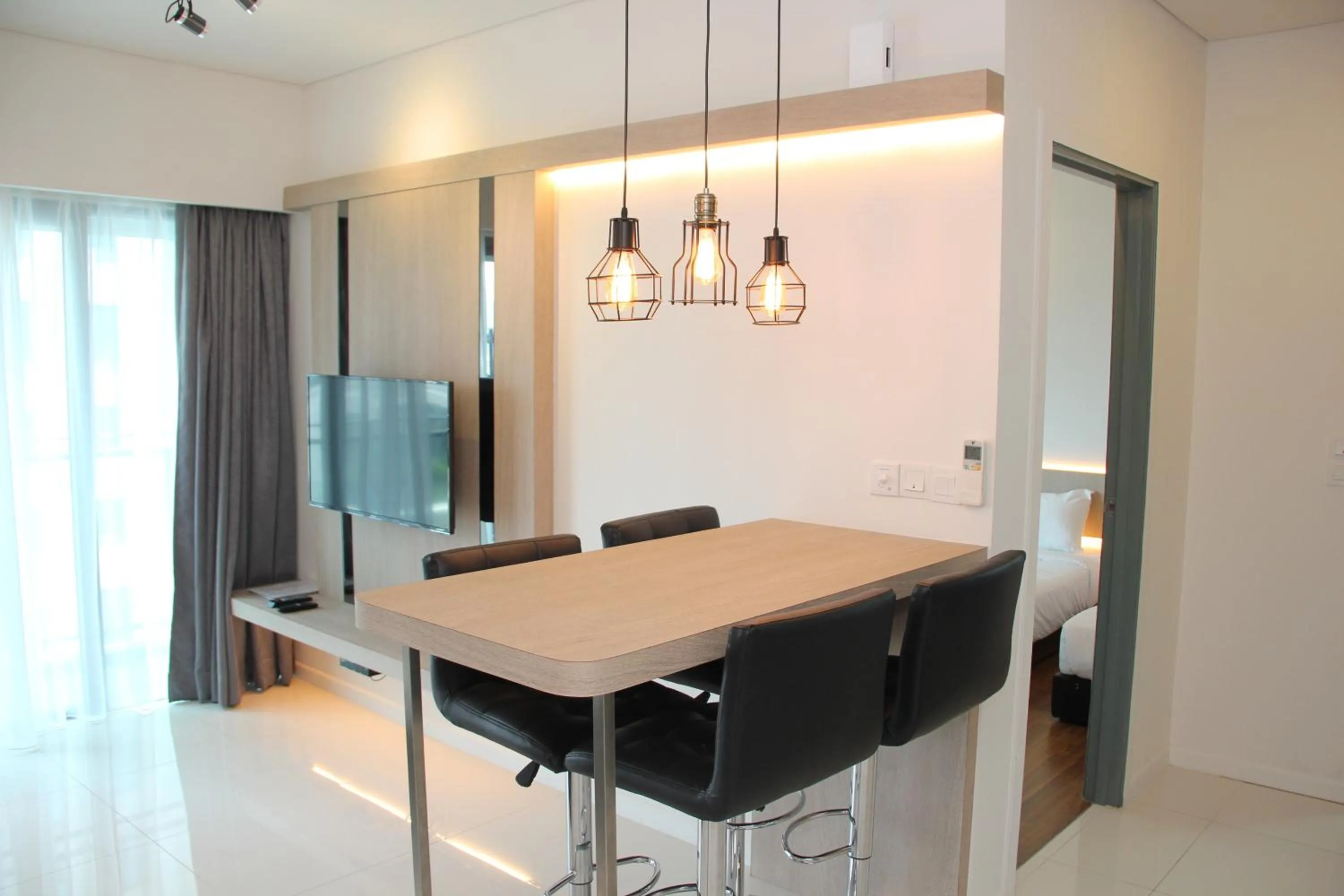 Dining area in Summer Suites Residences by Subhome