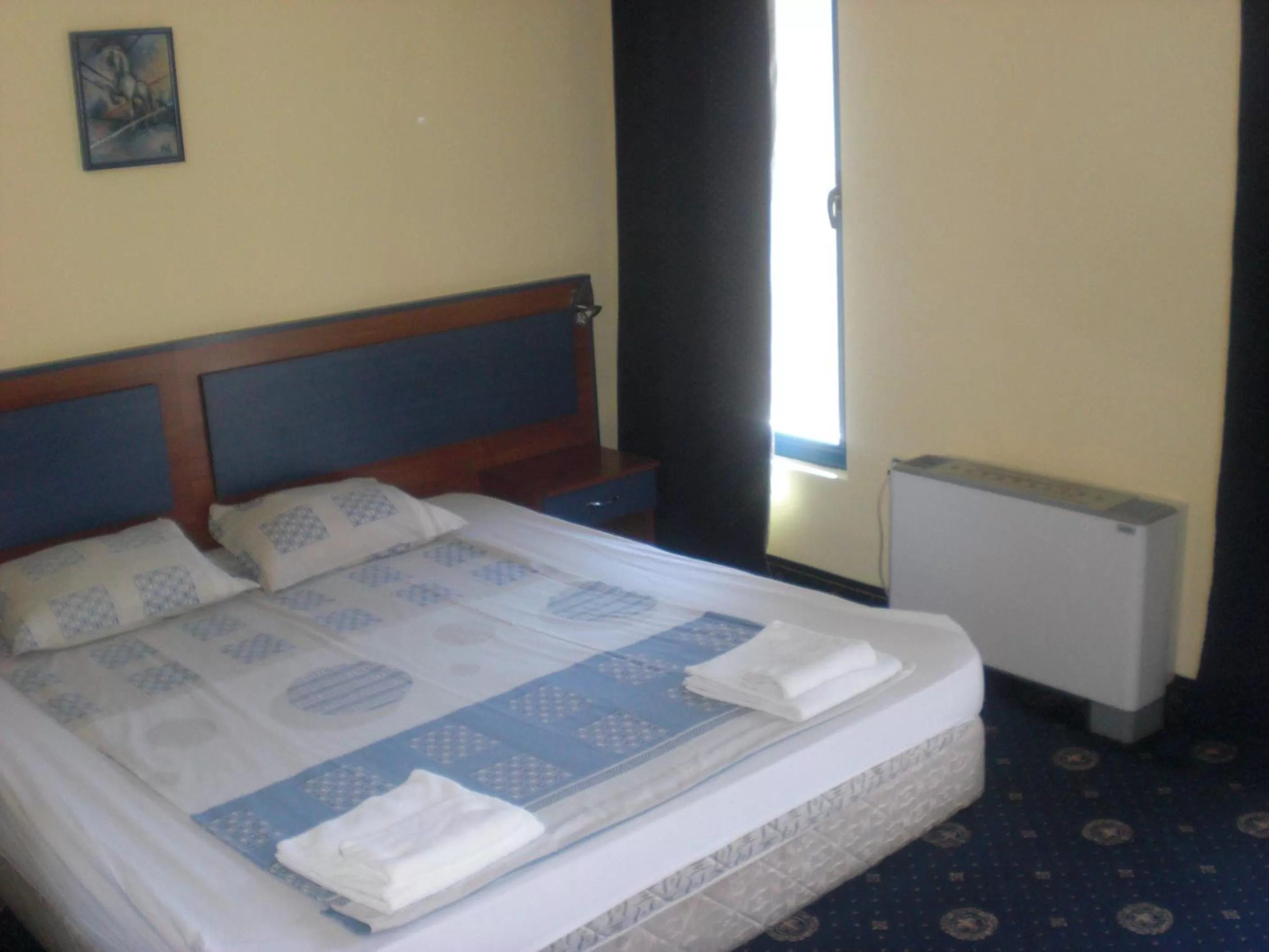 Bed in Fenix Family Hotel