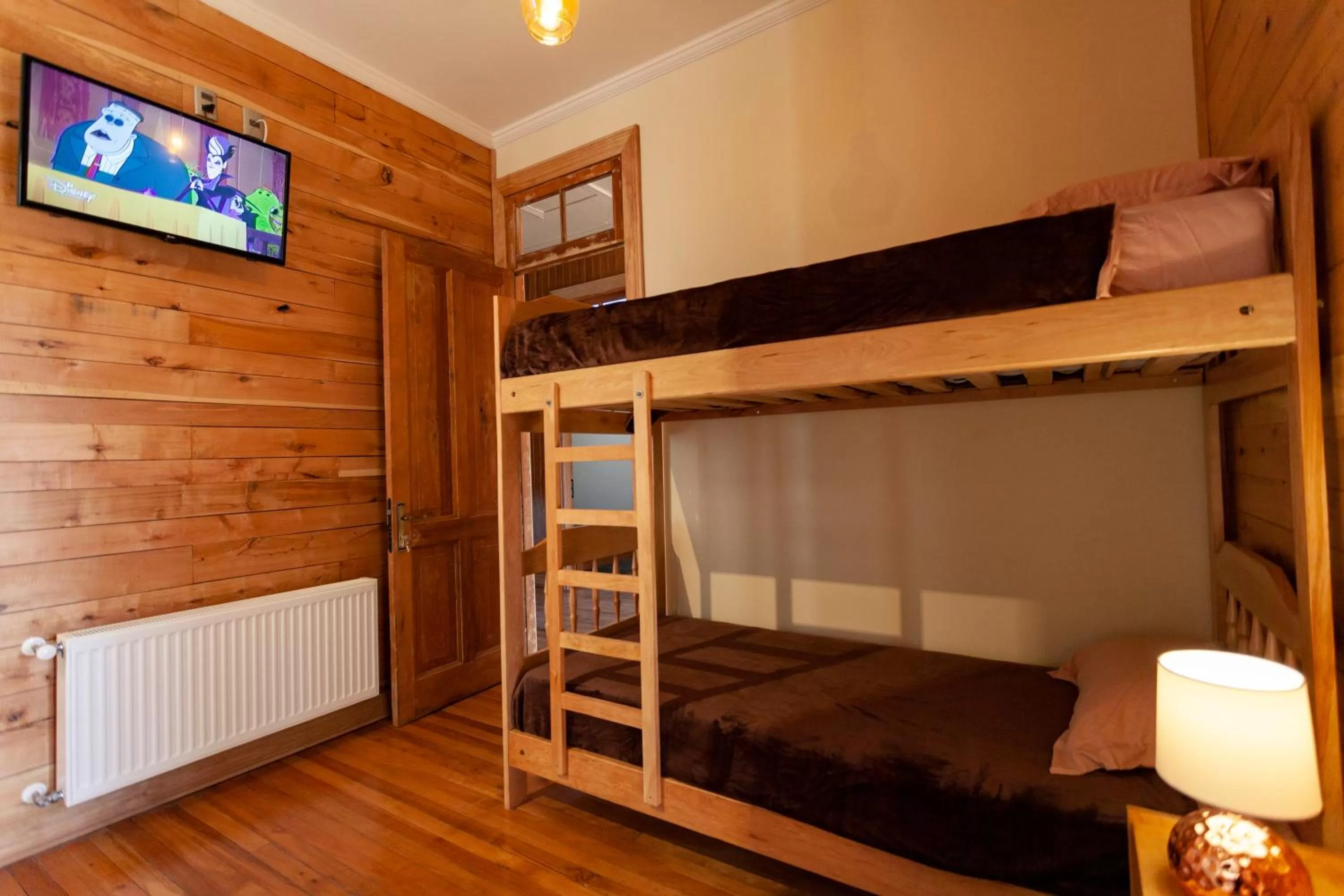 Photo of the whole room, Bed in Hostal Boutique Patagonia Mística