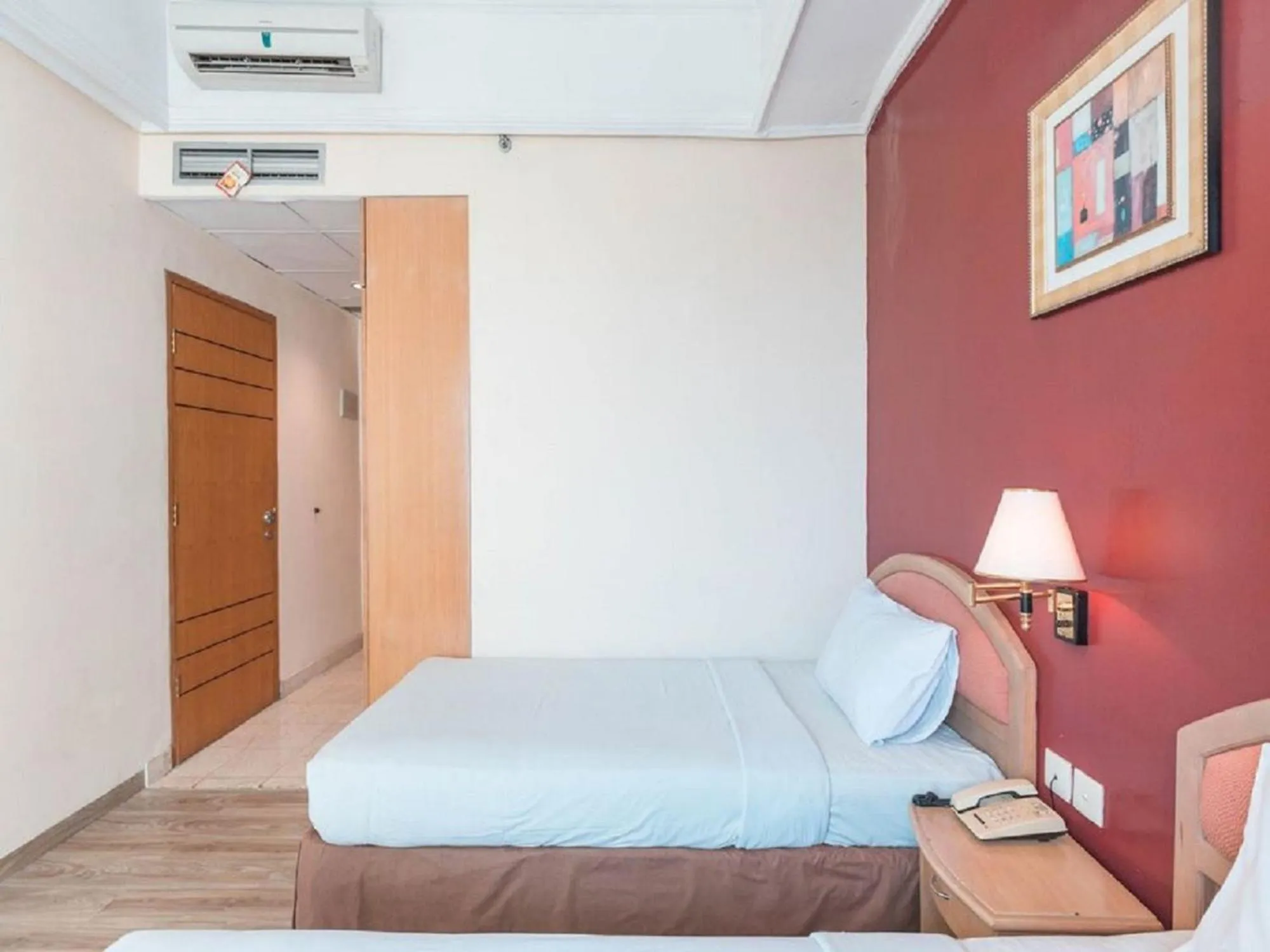 Bed in Hotel Bulevar Tanjung Duren Jakarta