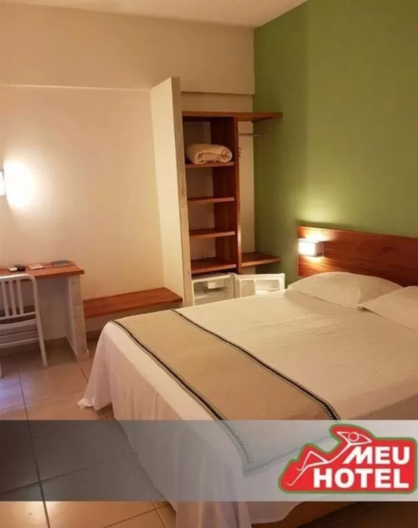 Bed in Meu Hotel Garça