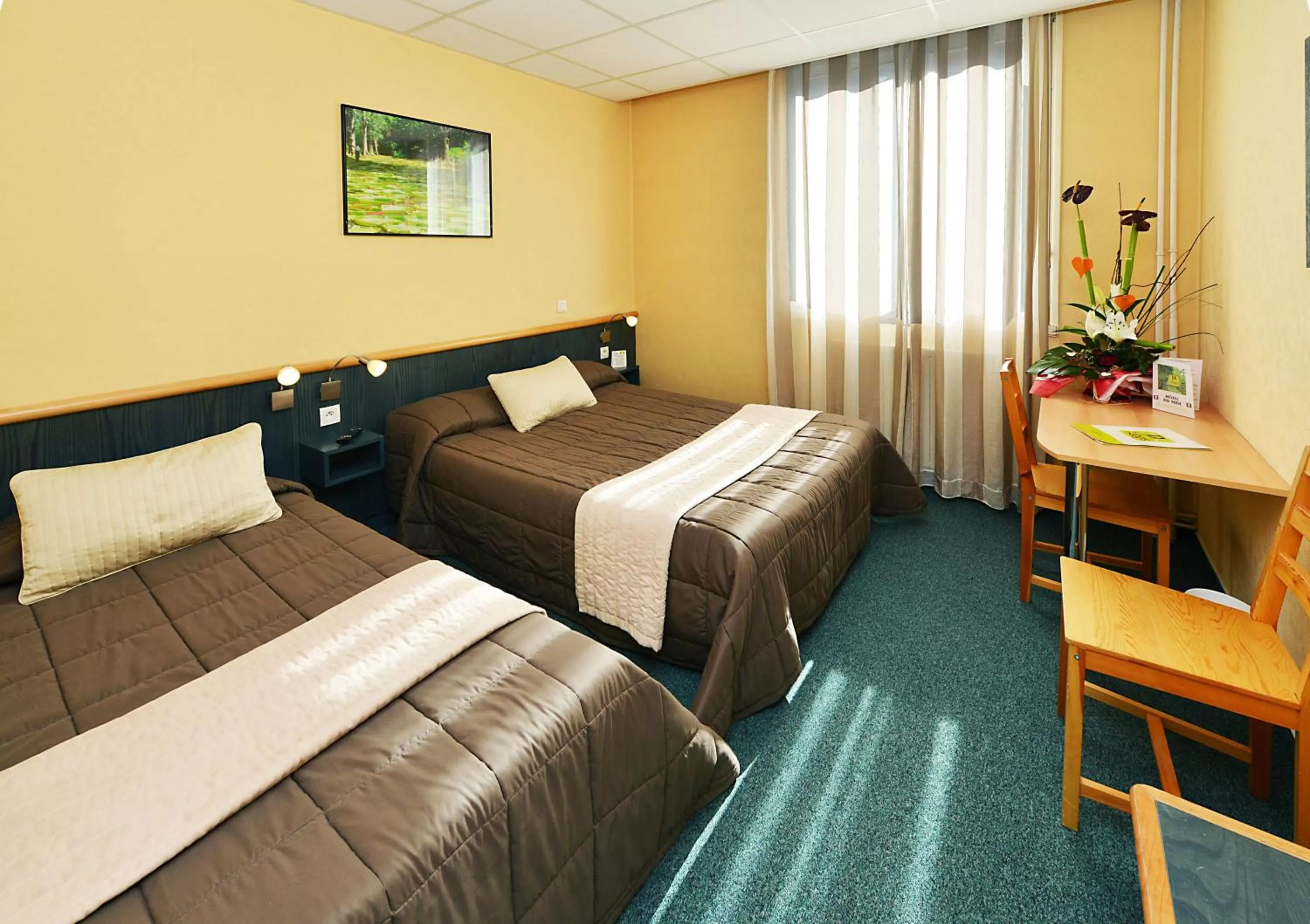 Photo of the whole room, Bed in Logis Hôtel Restaurant du Midi - Rodez Centre