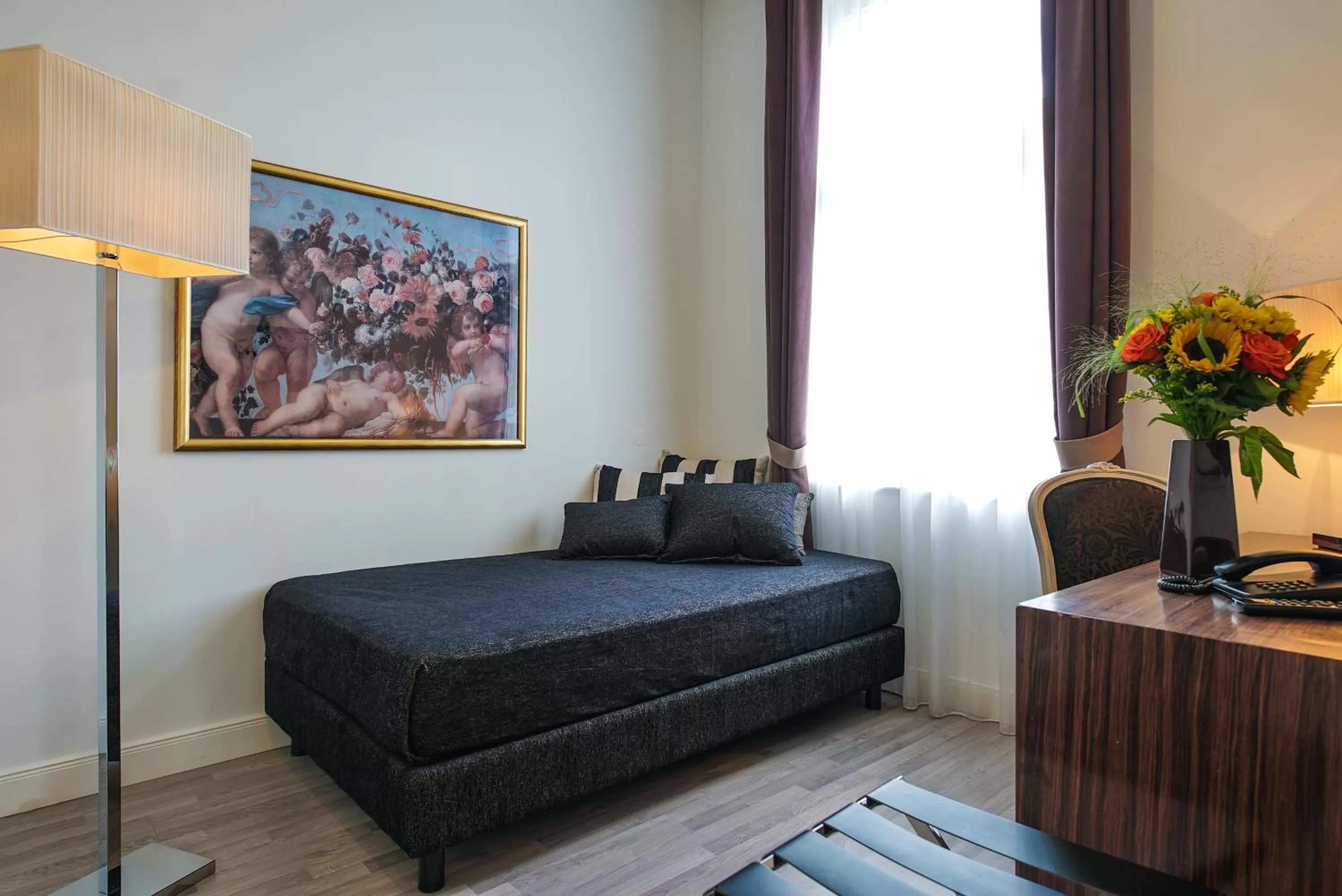 Living room, Bed in Hotel Assenzio Prague