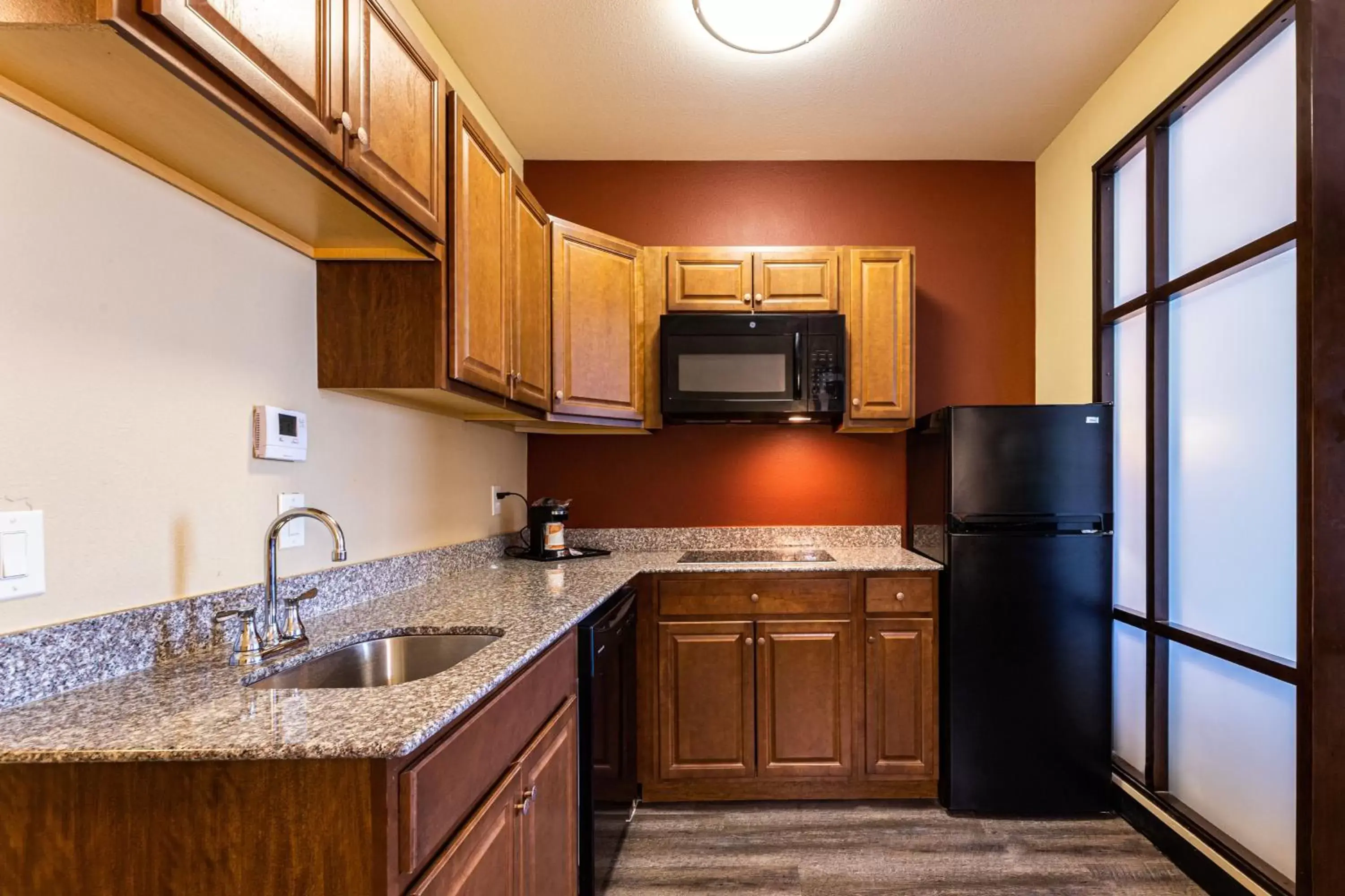 Efficiency King Suite with Kitchenette in Comfort Suites Lake Worth Efficiency King Suite with Kitchenette in Comfort Suites Lake Worth