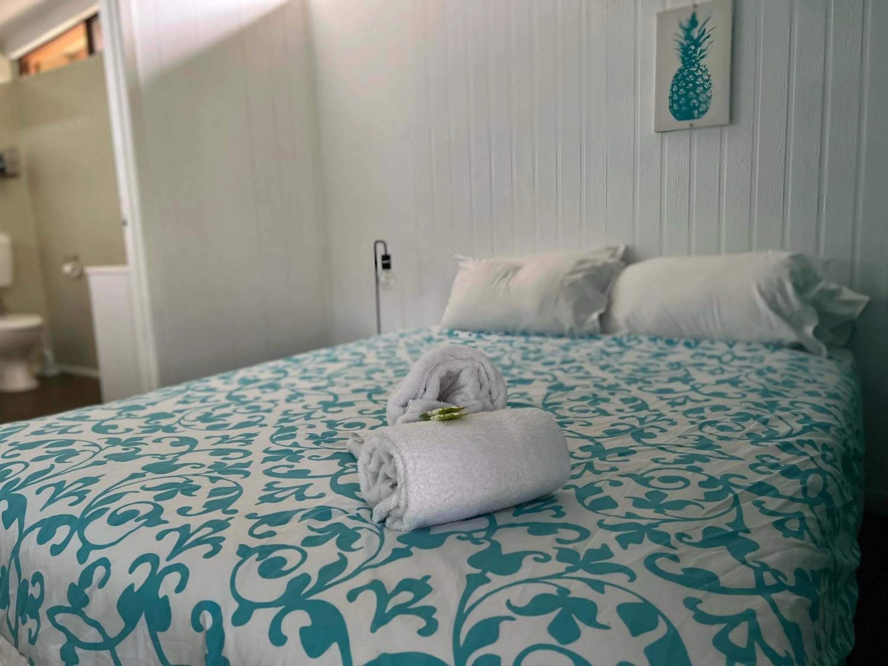 Bed in Colonial Village Resort