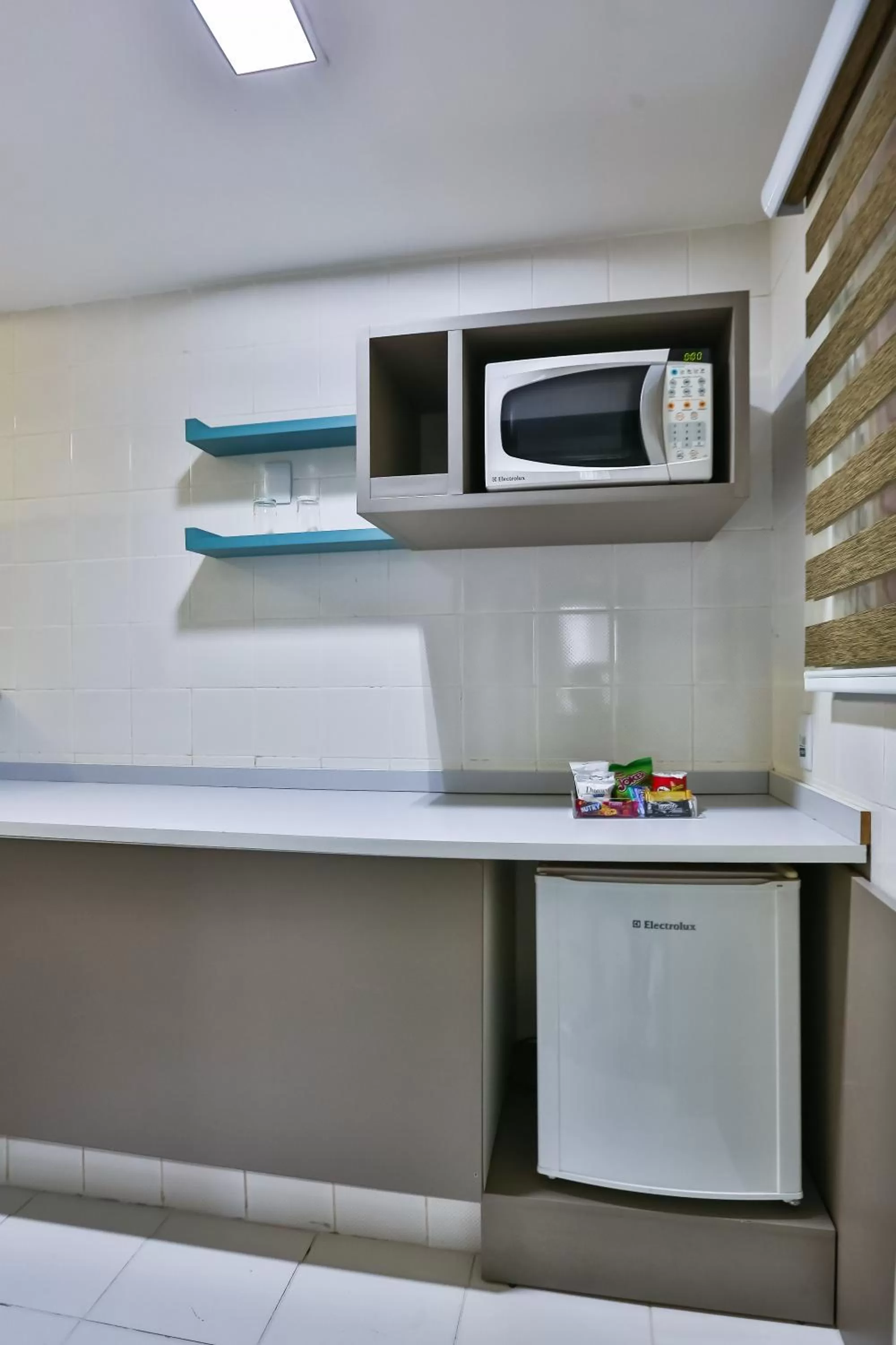 Kitchen or kitchenette in Wyndham Golden Foz Suítes