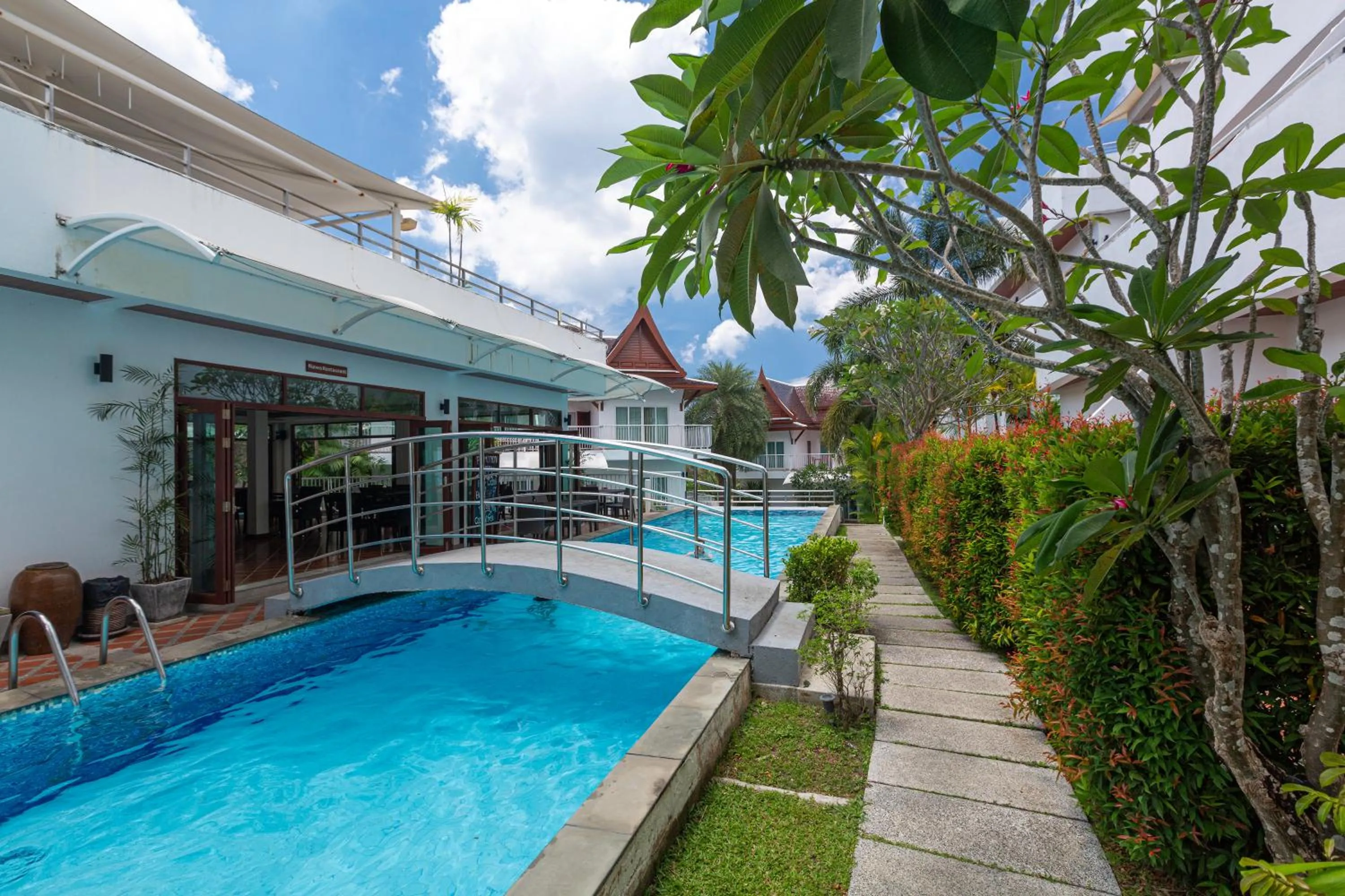 Swimming pool in Phunawa Resort Phuket Karon Beach - SHA Plus