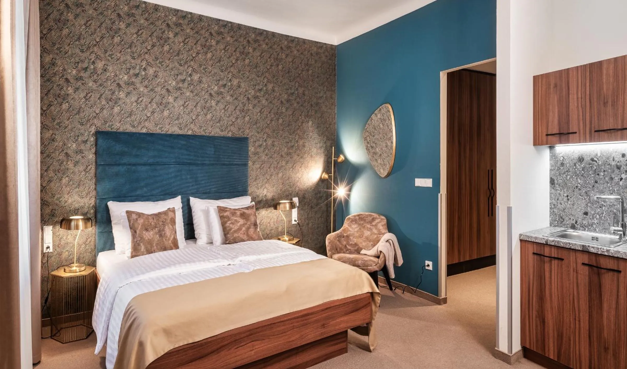 Bed in Golden Angel Suites by Adrez