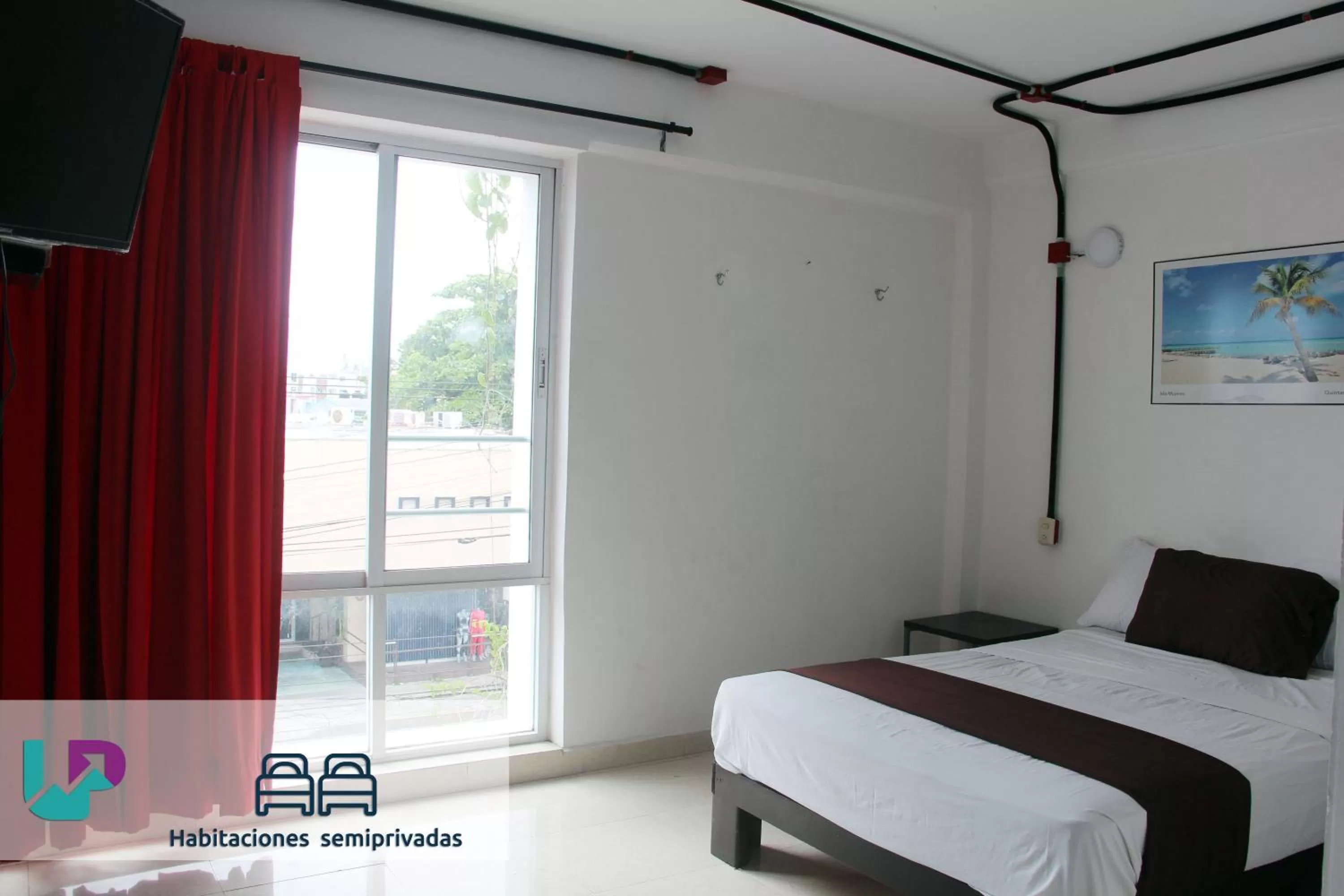 Photo of the whole room, Bed in Hotel & Hostal Casa de Luz Cancun