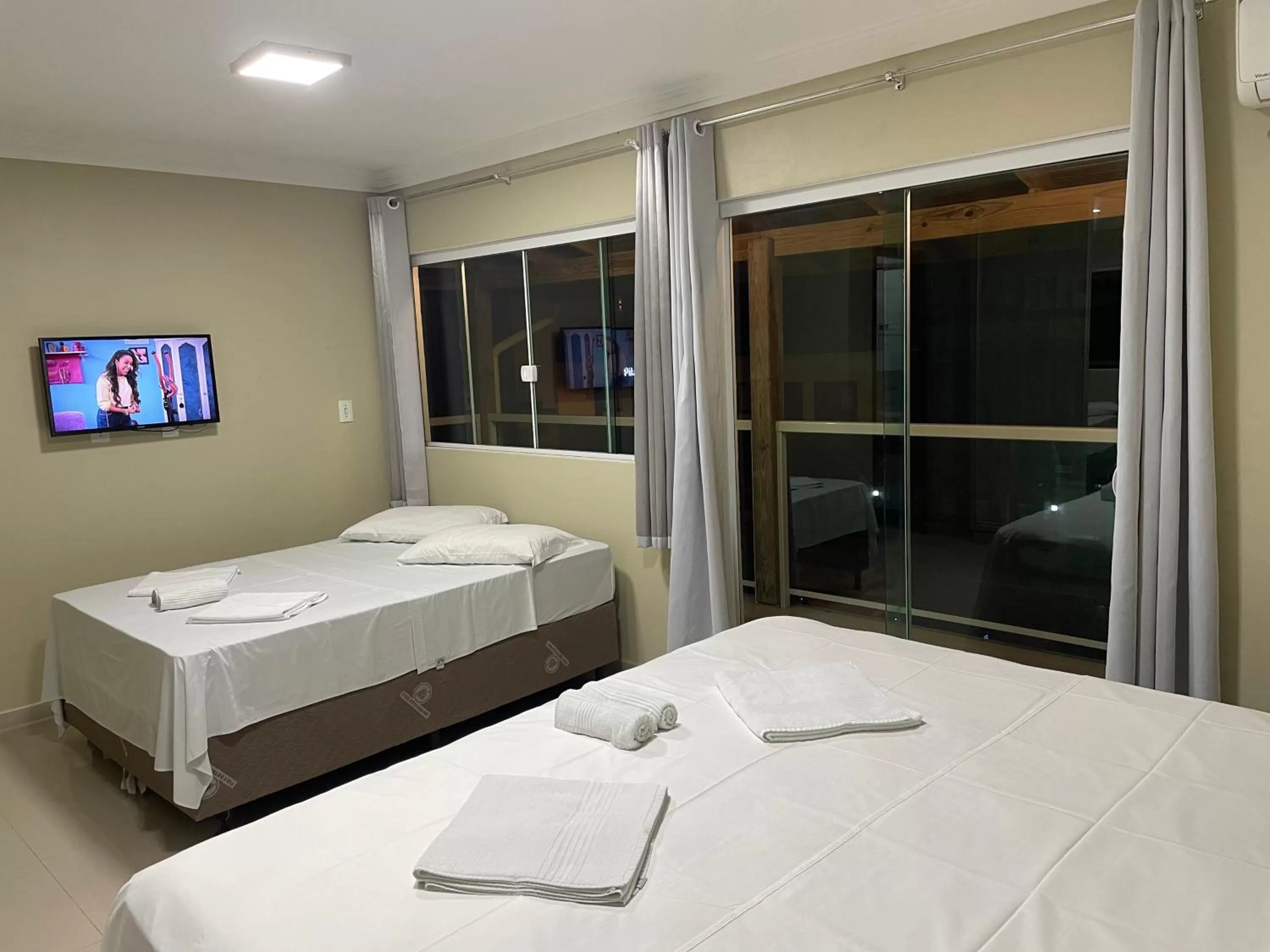 Bed in Pousada Tissiano