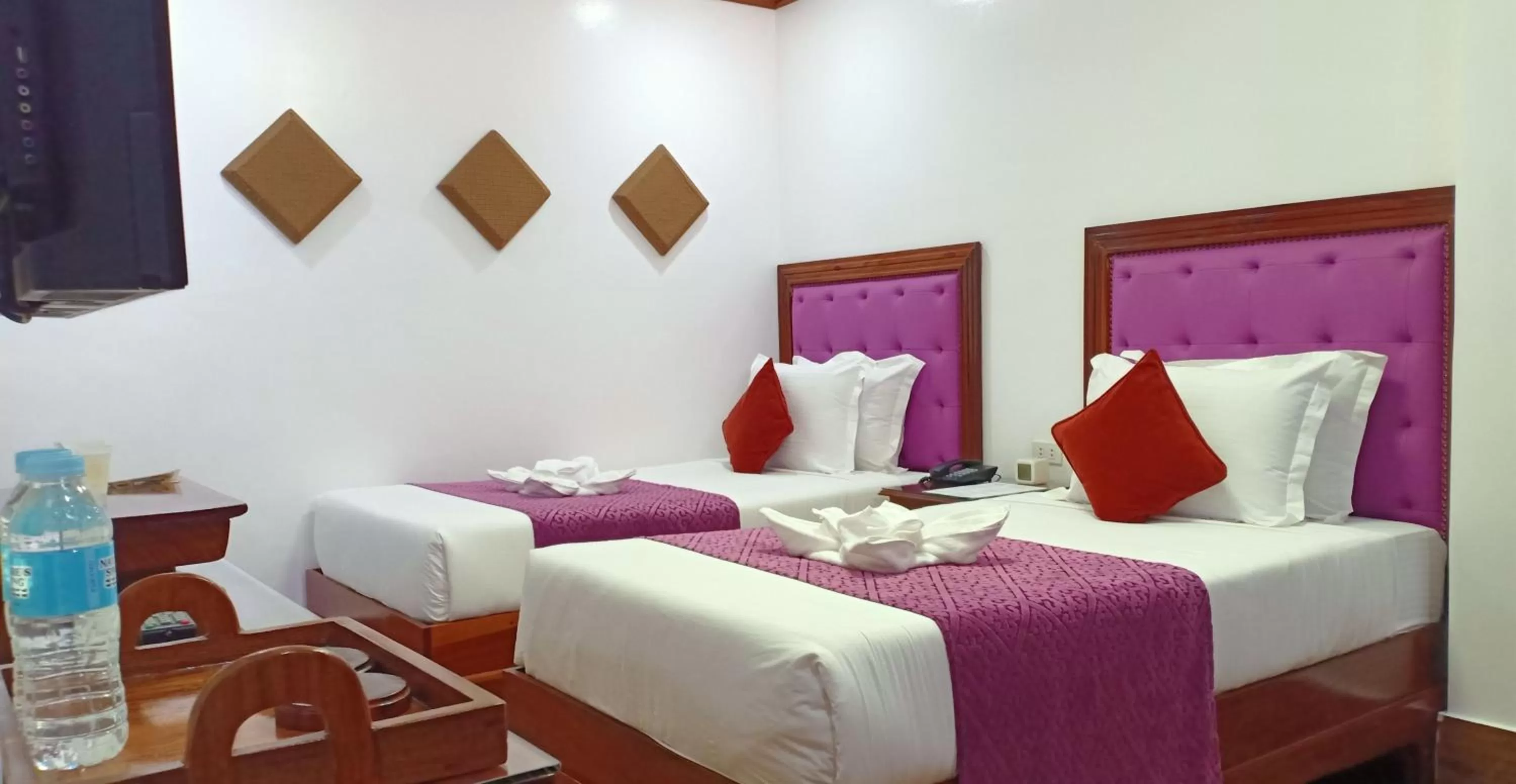 Bed in CLN Boutique Hotel