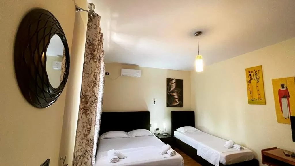 Bed in Hotel Ambasador Garden