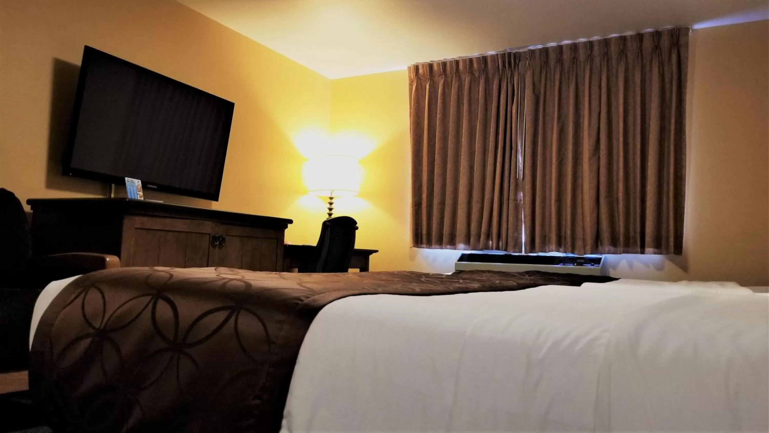 Bed in The Royal Victorian Motel