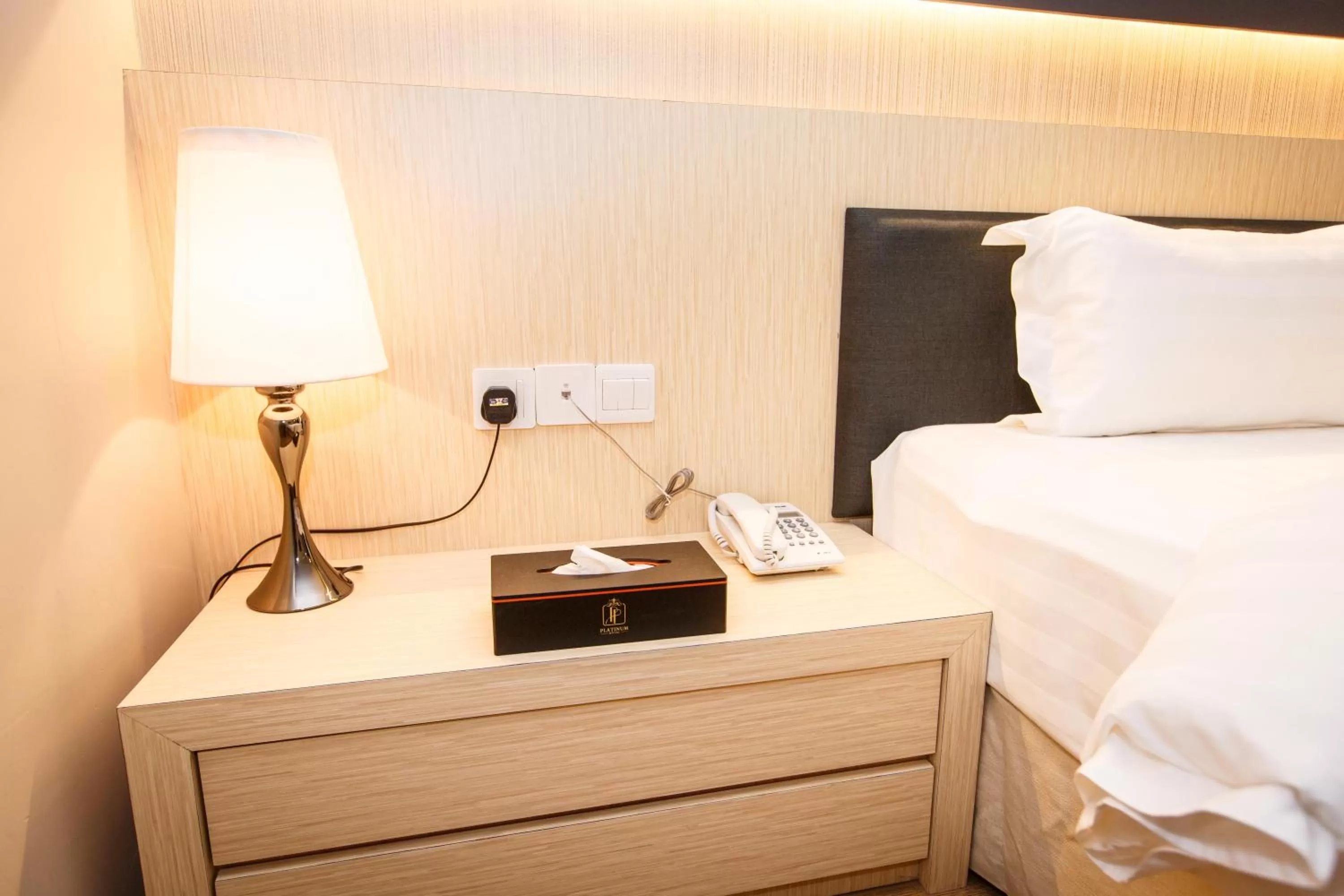 Bed in Lintas Platinum Hotel