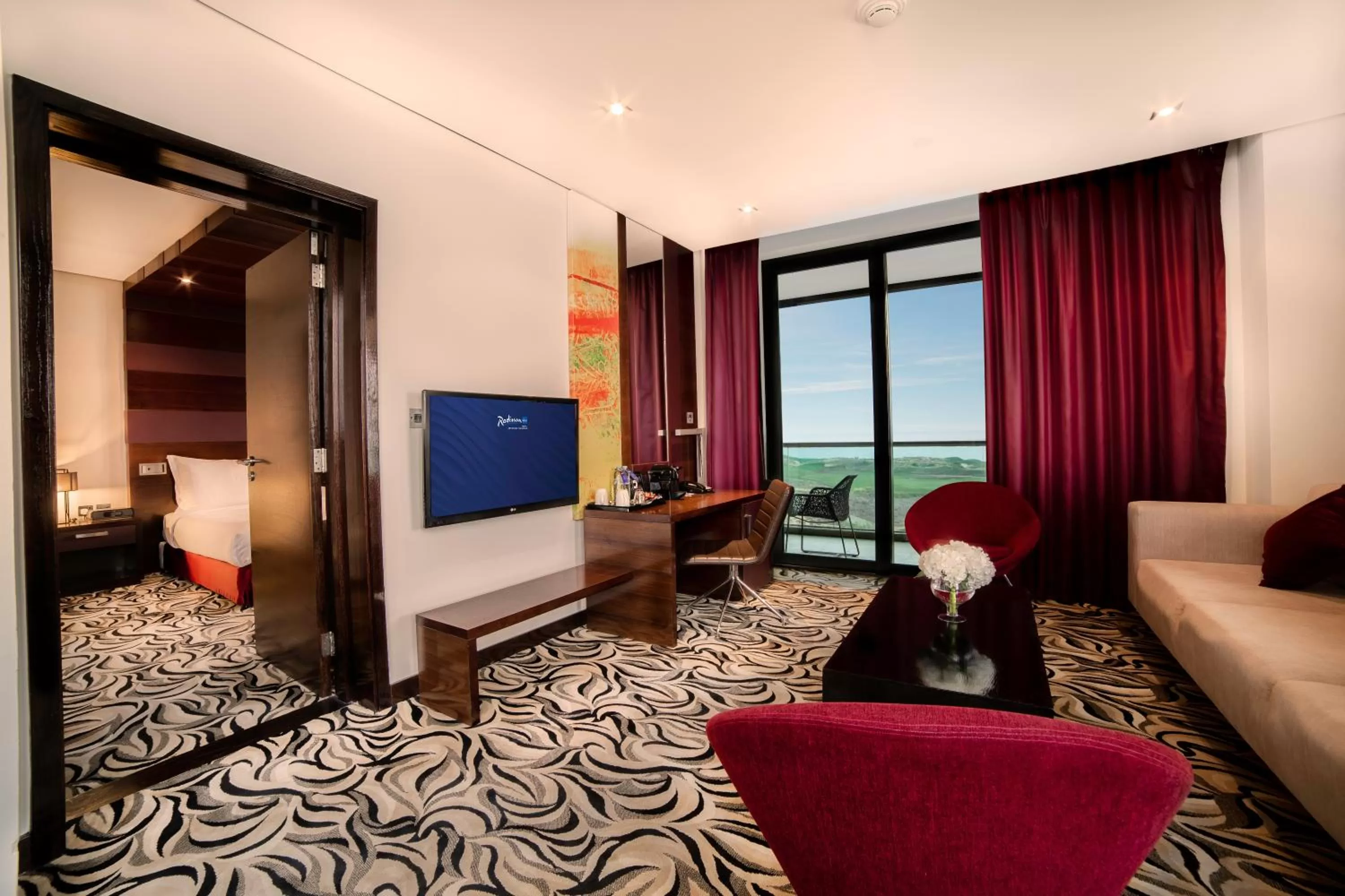 Living room, Bed in Radisson Blu Hotel, Abu Dhabi Yas Island