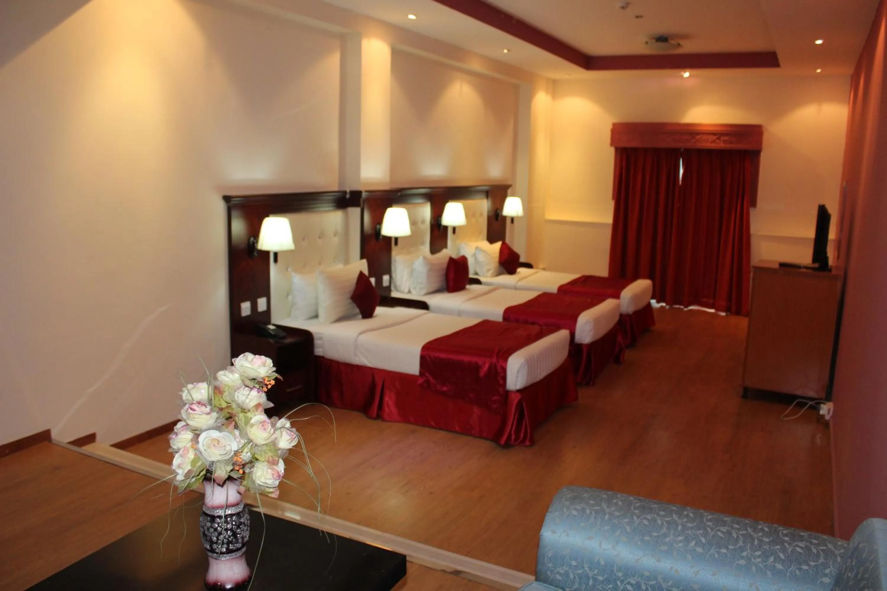 Bed in Grand Nova Hotel