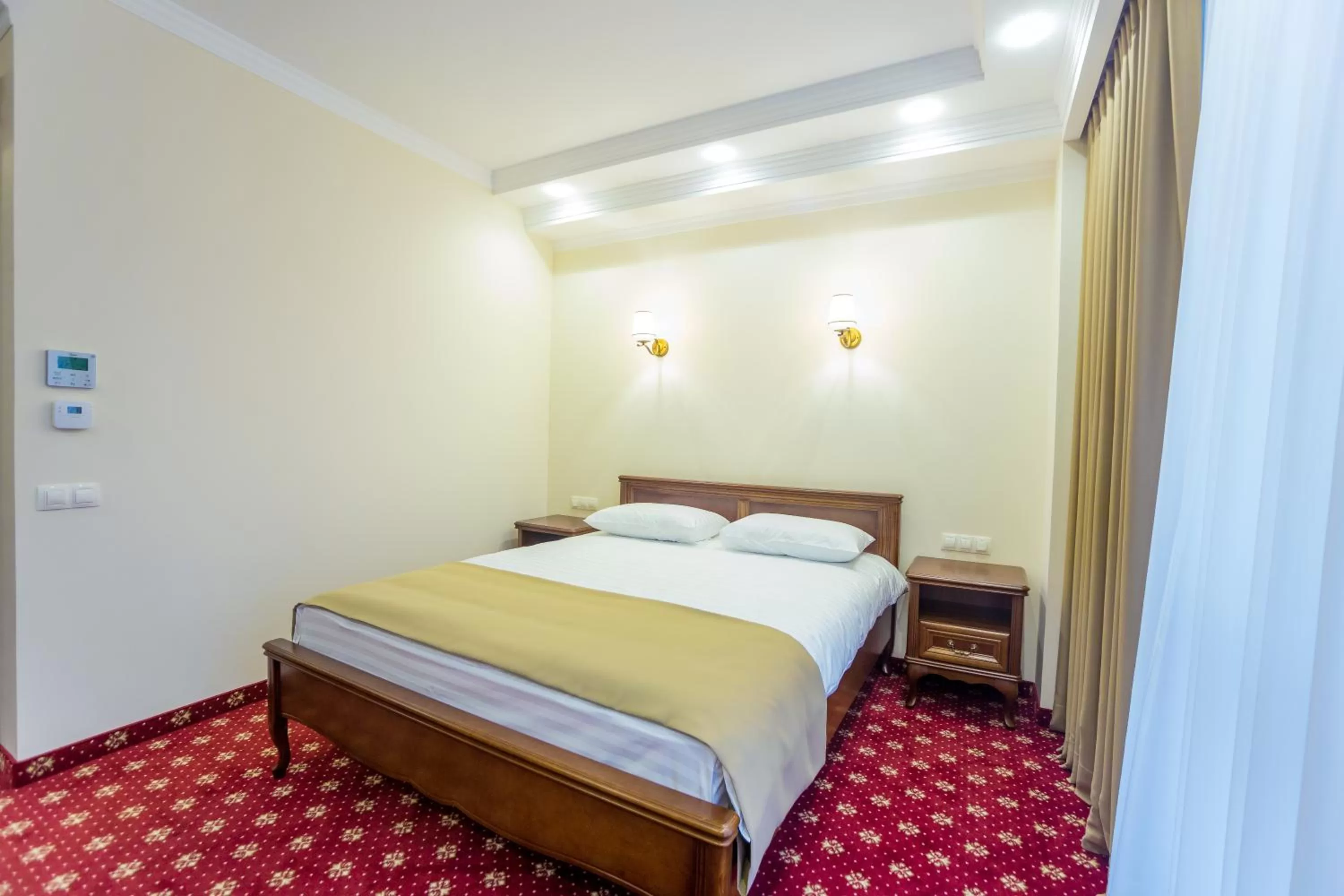 Bed in Ambassador Hotel