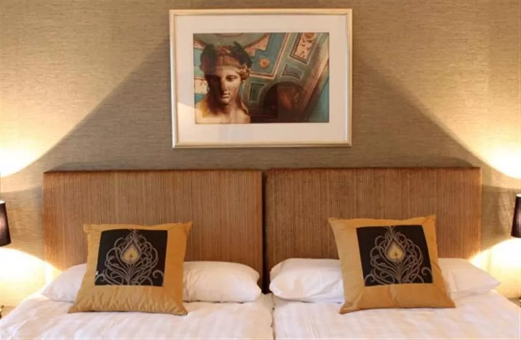 Bed in Art Hotel Honkahovi