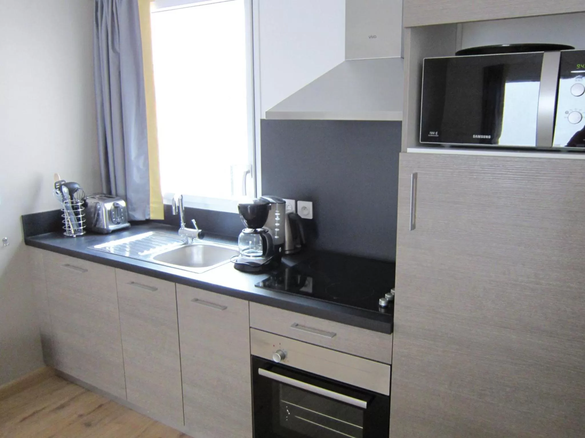 Kitchen or kitchenette in Lagrange Vacances Les Patios Eugénie