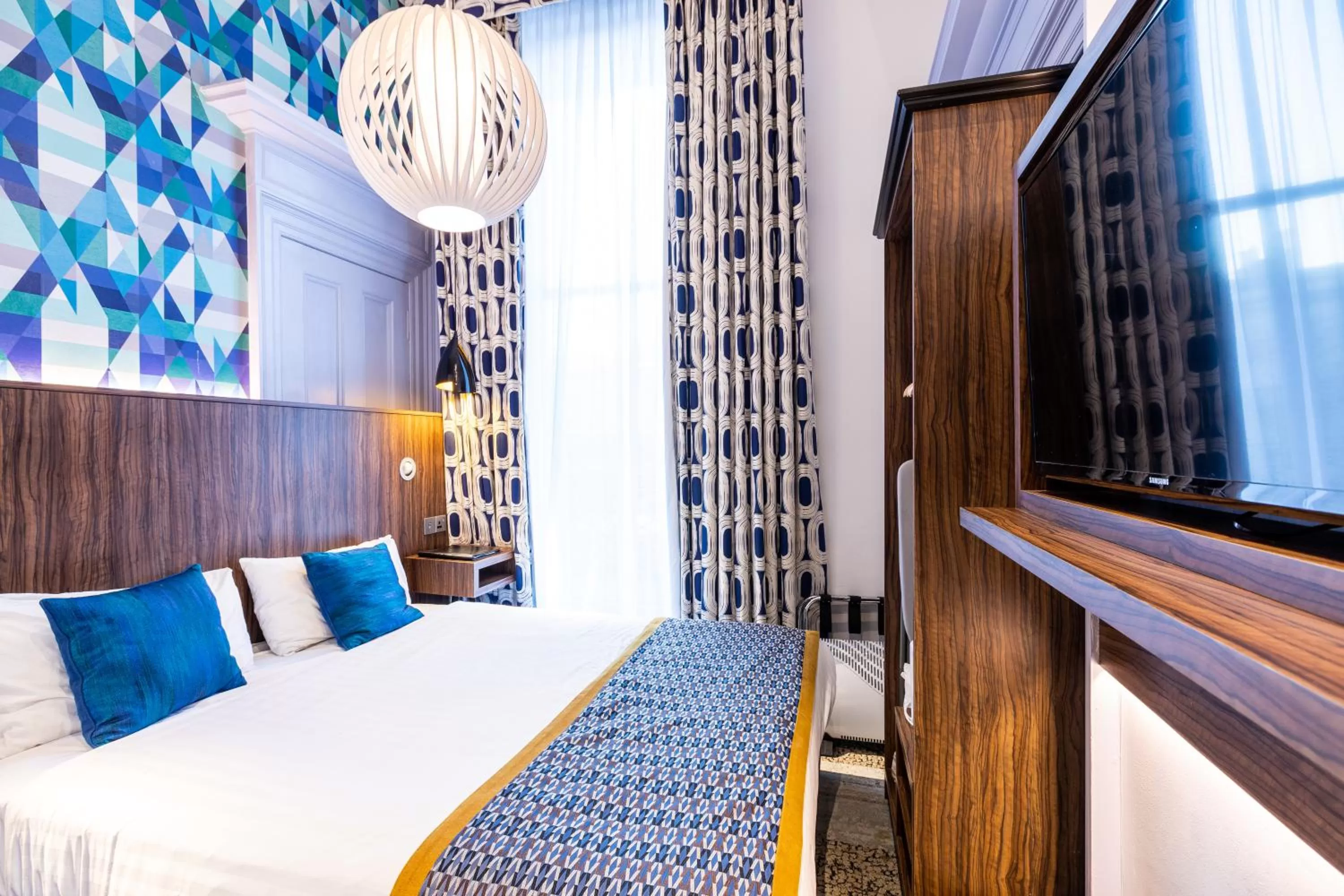 Bed in Cairn Hotel & Apartments