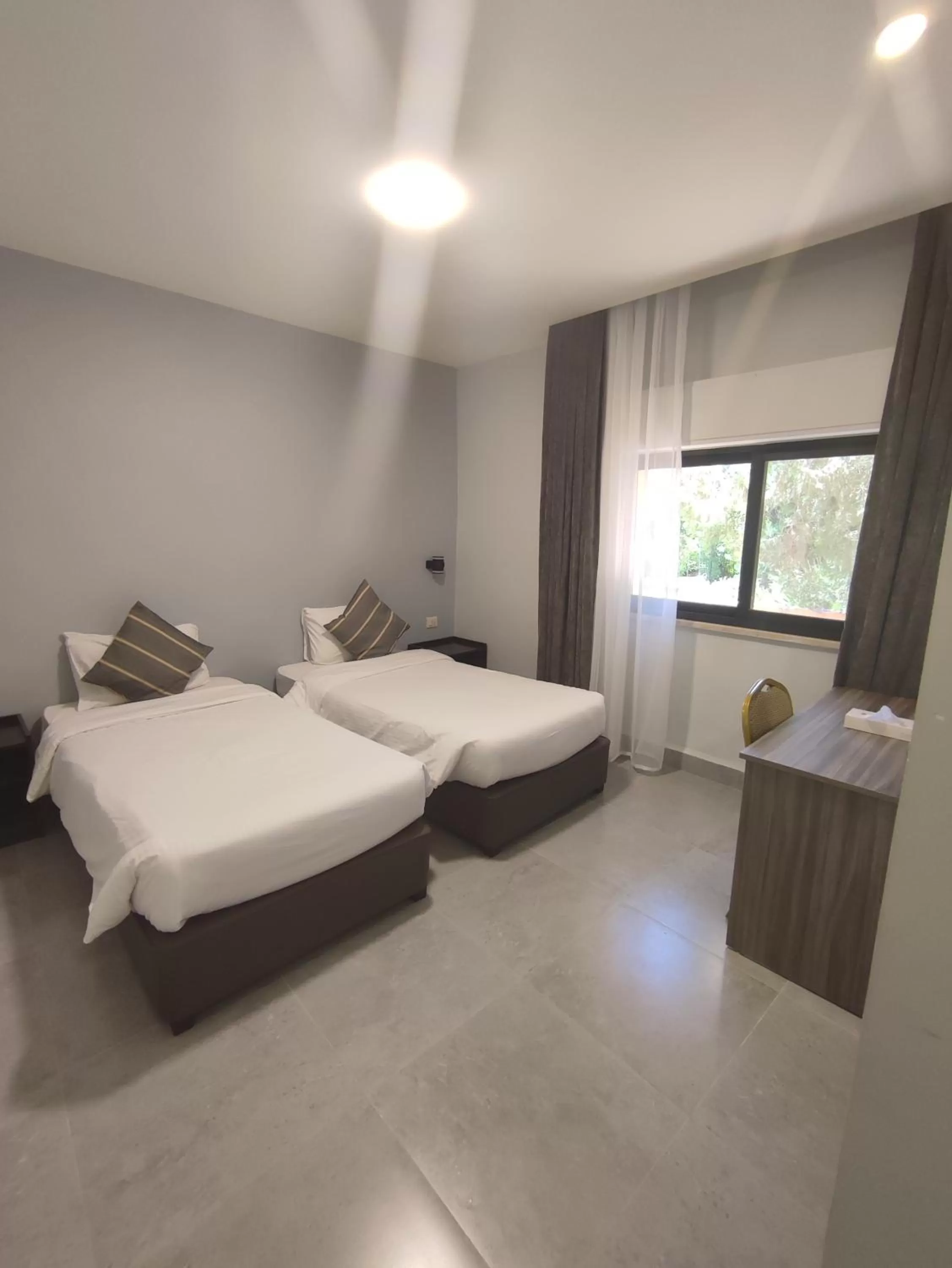 Bed in Black Iris Hotel