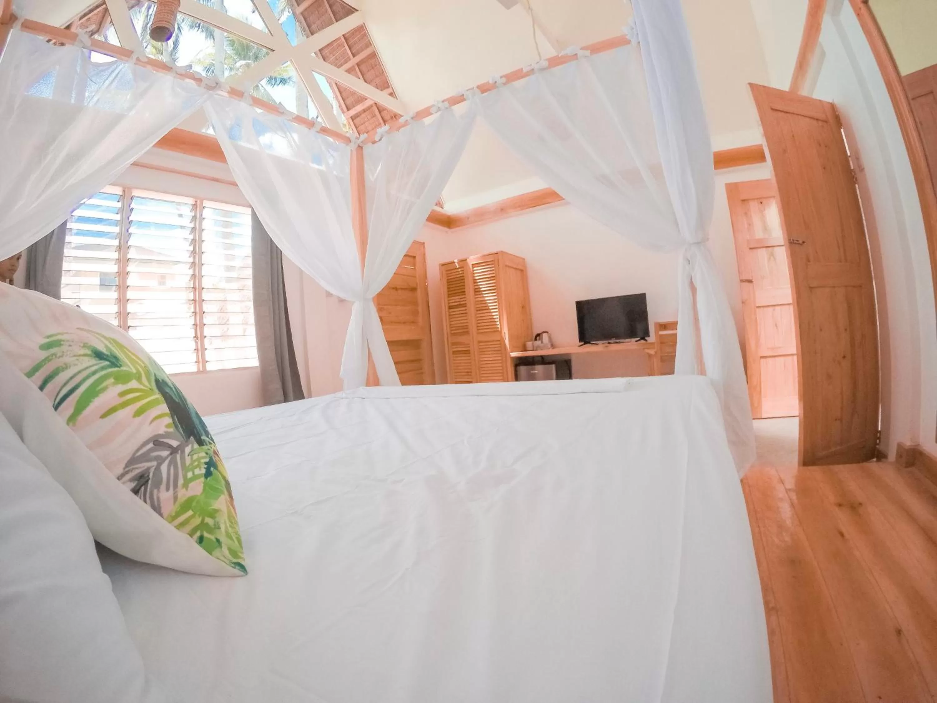 Photo of the whole room, Bed in Bermuda Triangle Bungalows