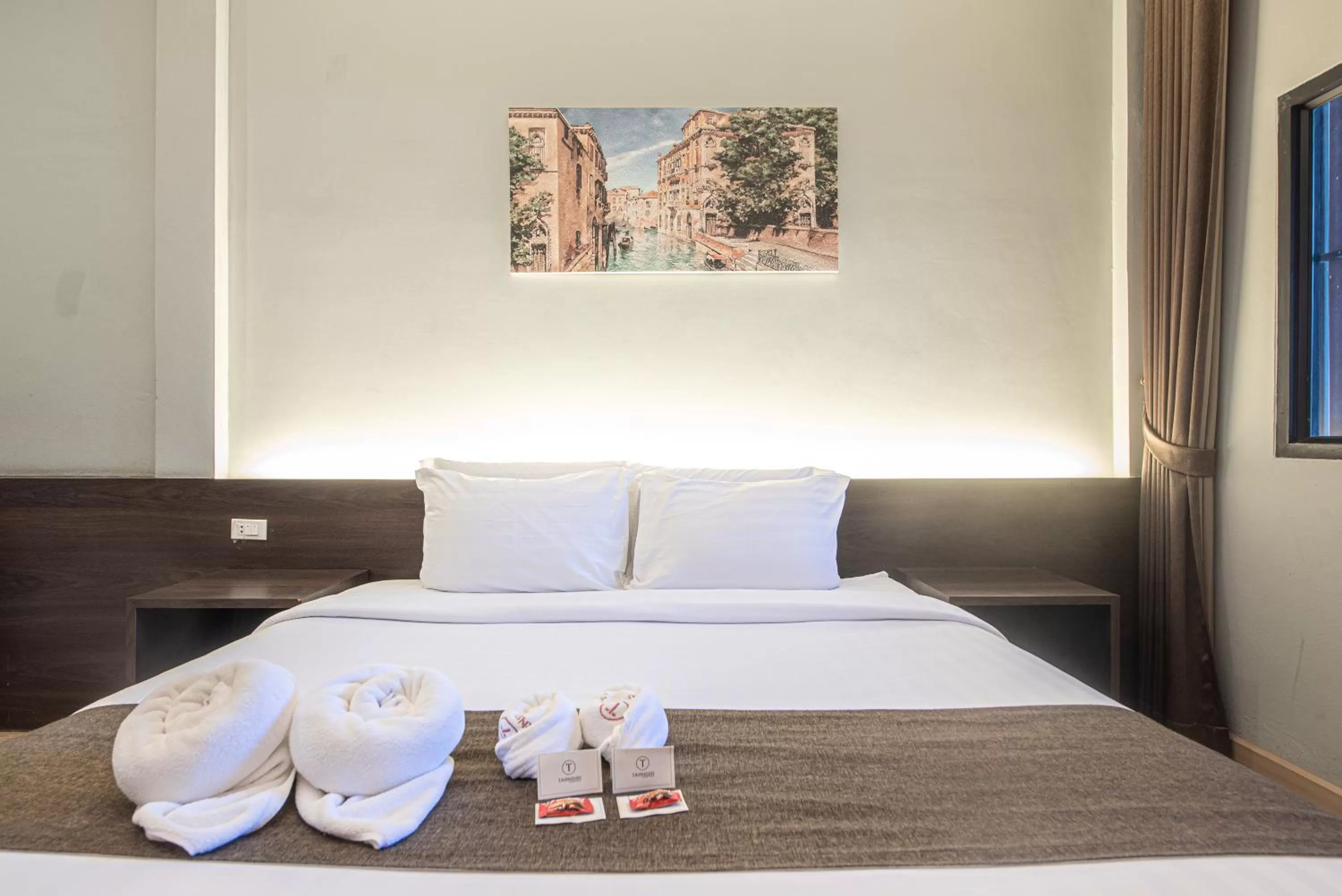 Bed in Tarnsiri Boutique Resort