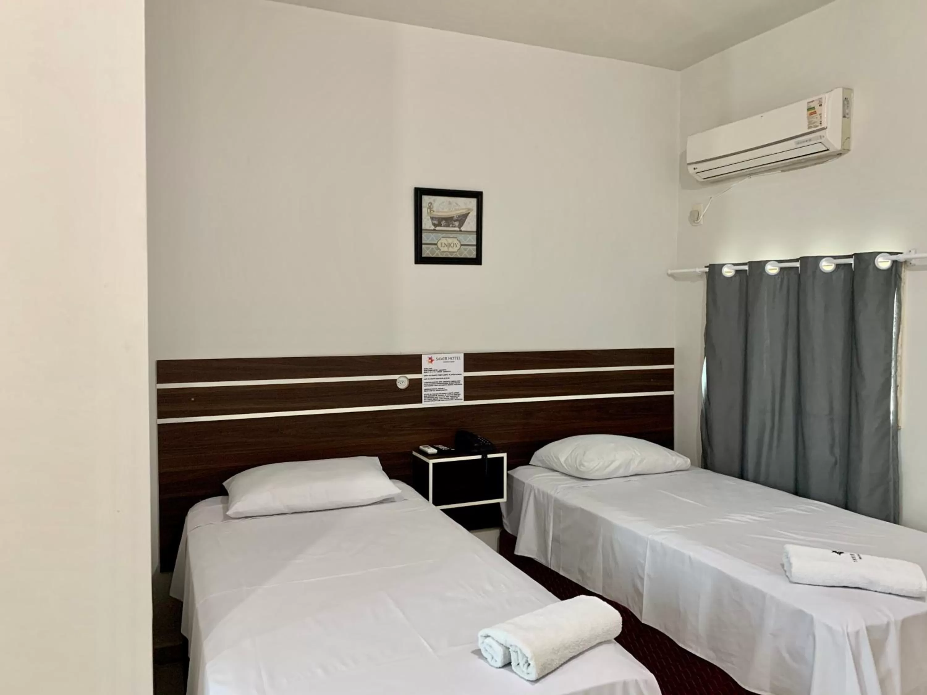 Bed in SAMIR HOTEL COMFORT