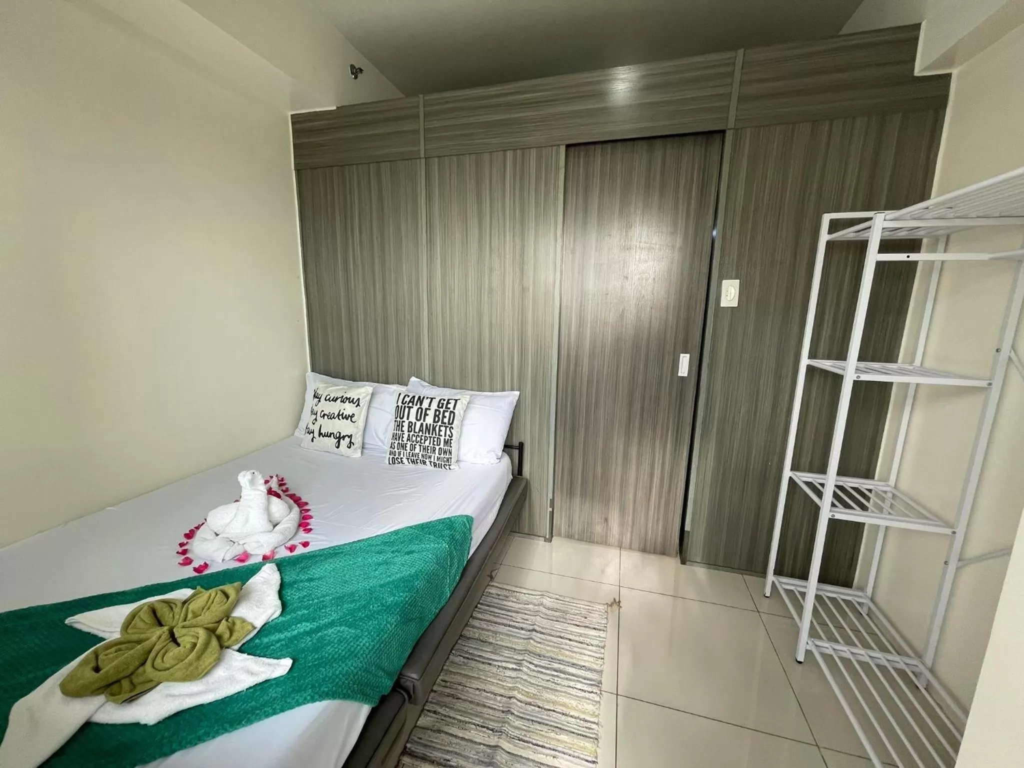 Bed in Green Residences Stays by PBYY