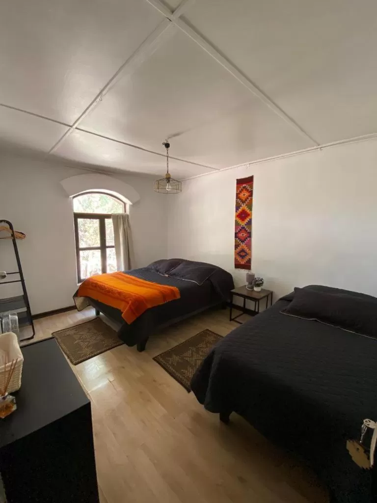Photo of the whole room, Bed in CaminAndes Hostal