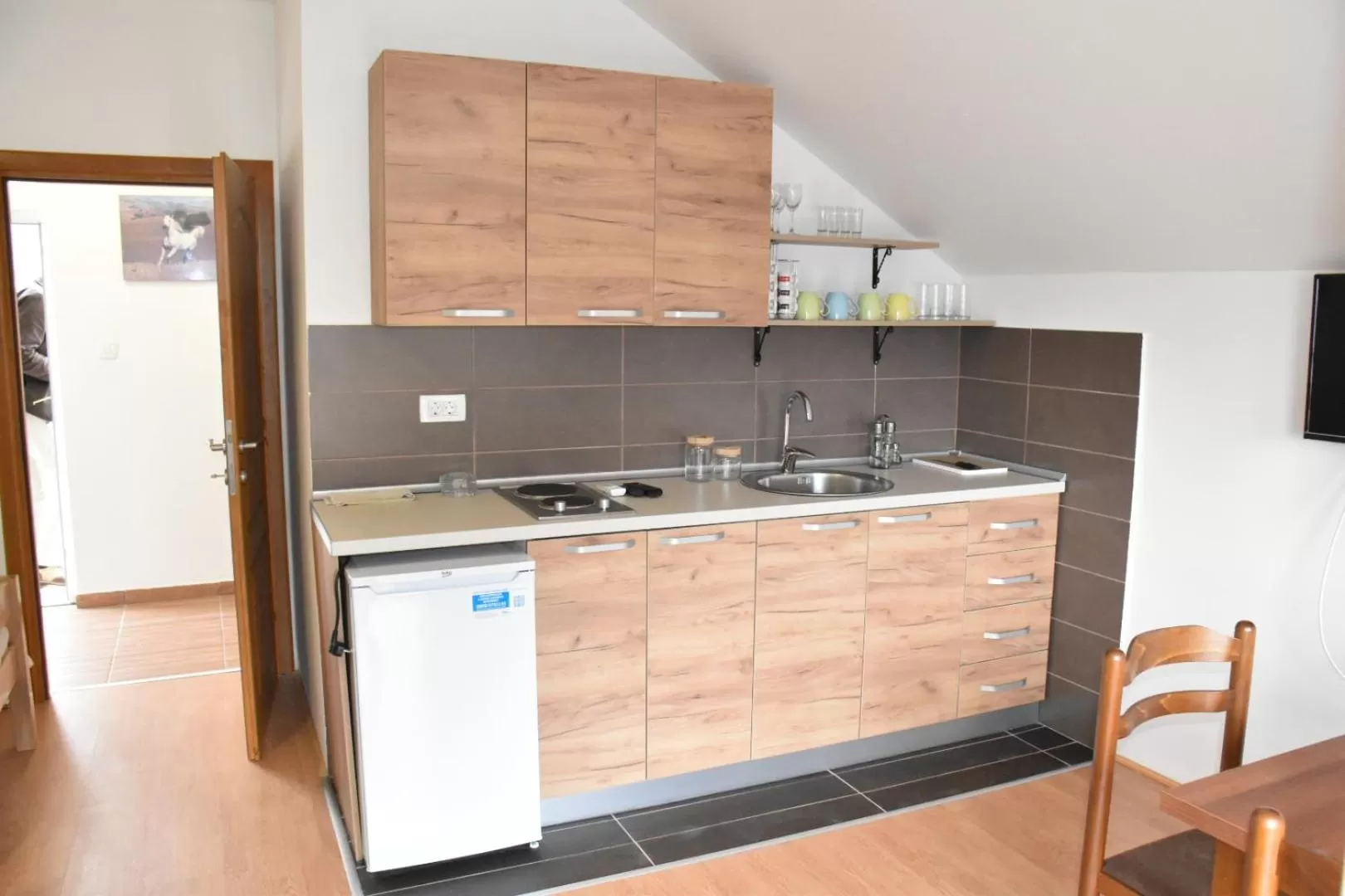 Kitchen or kitchenette in OSTROG Aparthotel KOLIBA-VLASTNIŠTVO MANASTIRA OSTROG