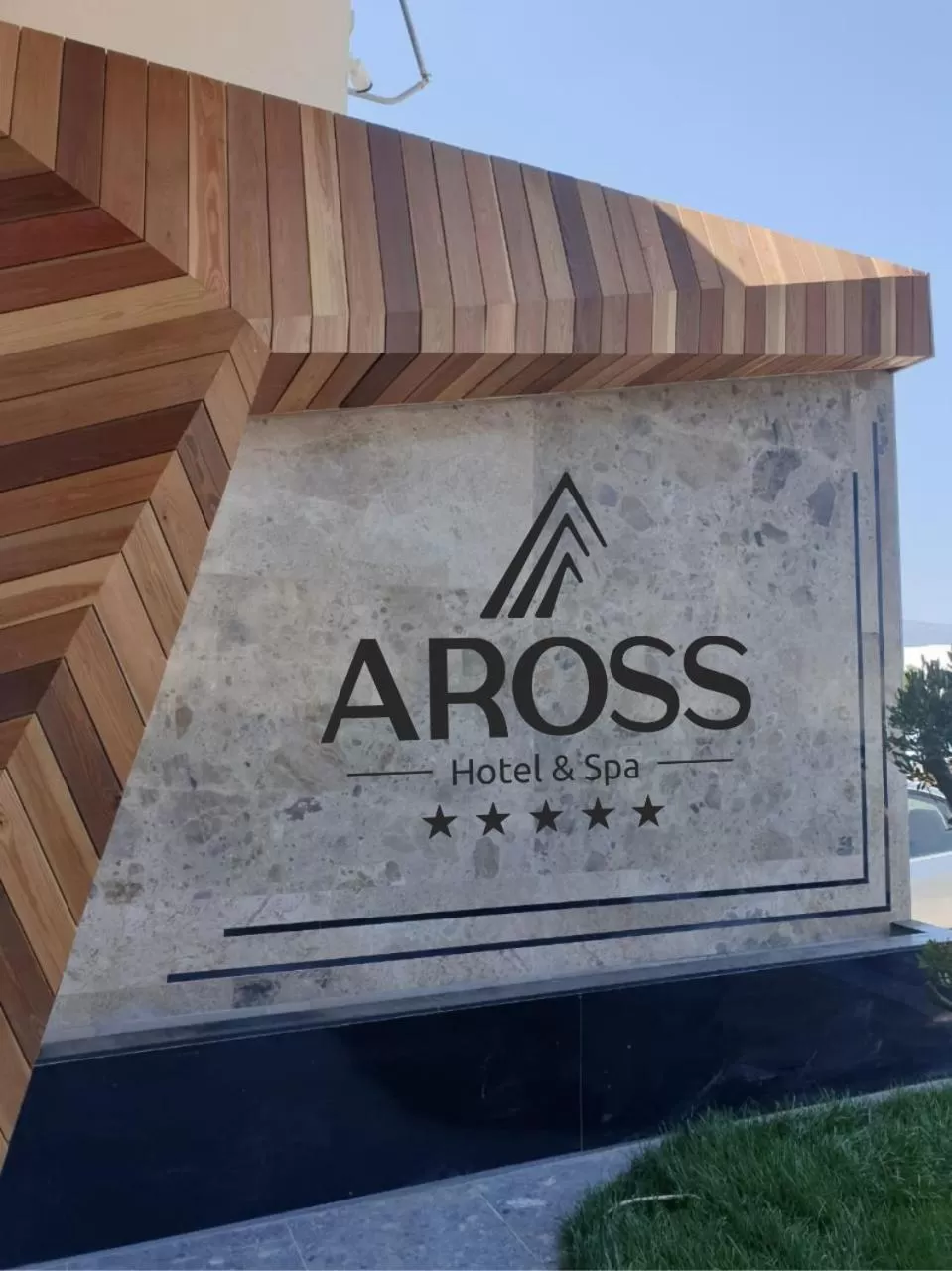 Property logo or sign in Hotel Aross
