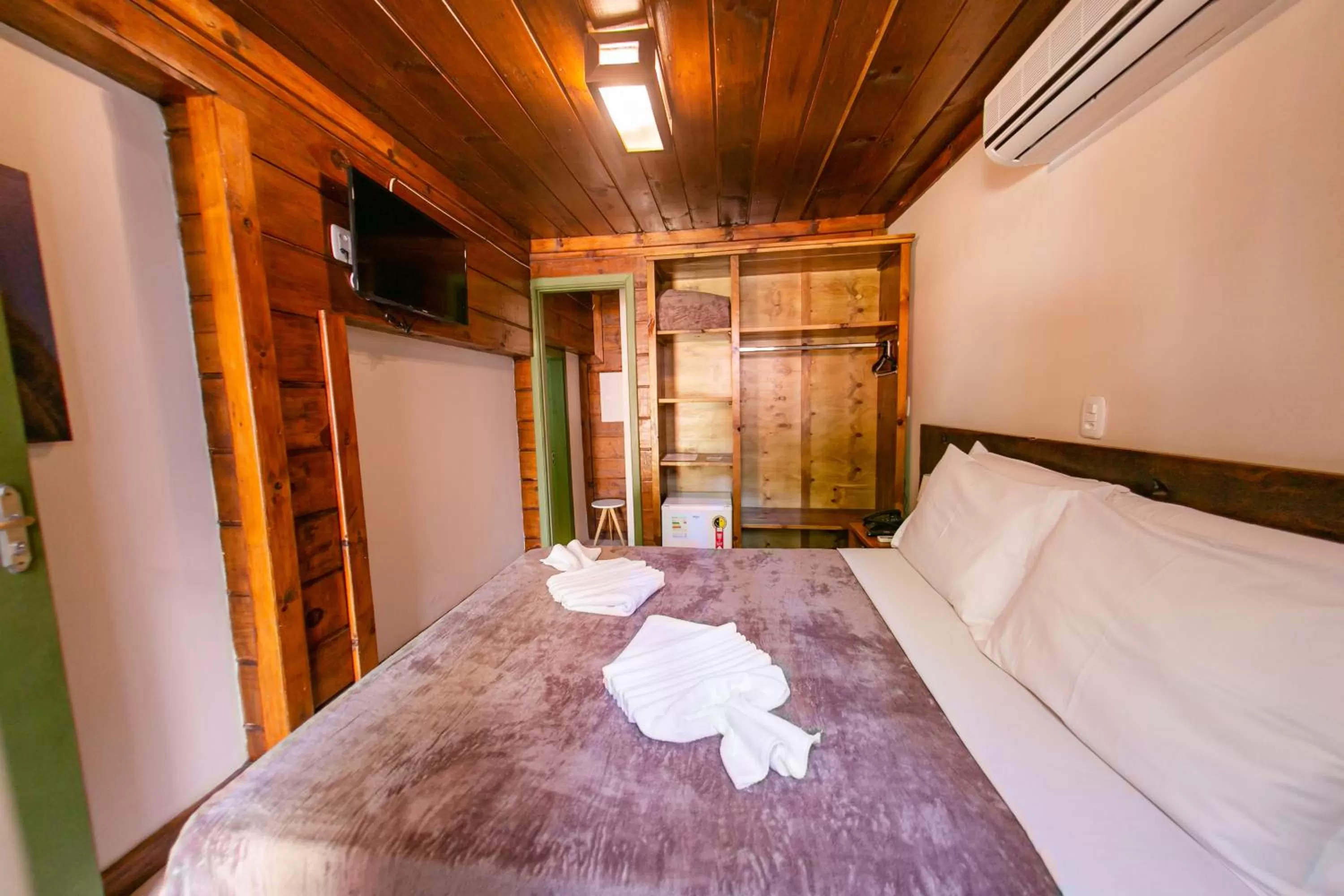 Bed in Pousada Charm Canela