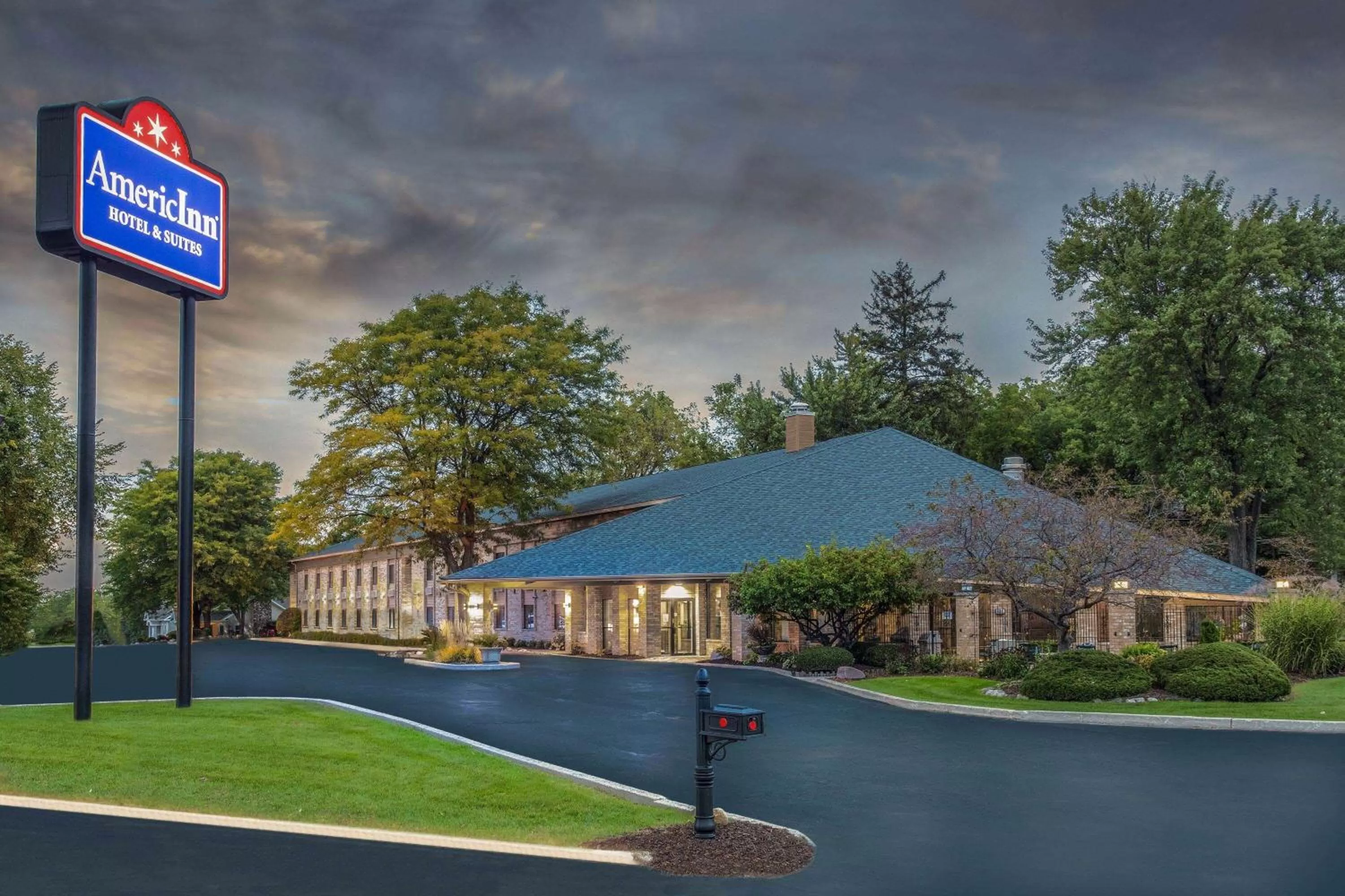 Property building in AmericInn and Suites by Wyndham Delafield-Waukesha-Milwaukee