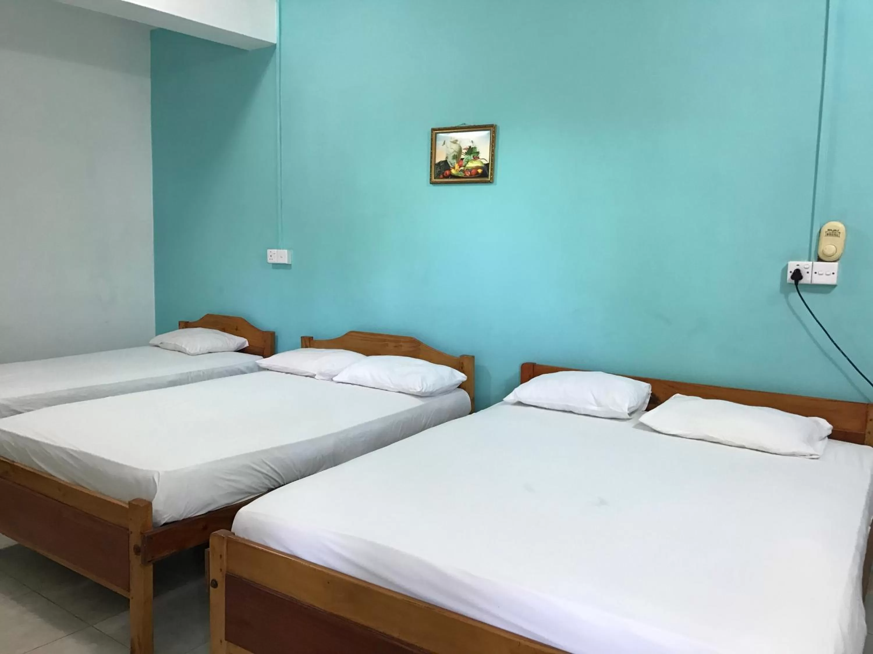 Bed in Gnaanams Hotel and Restaurant