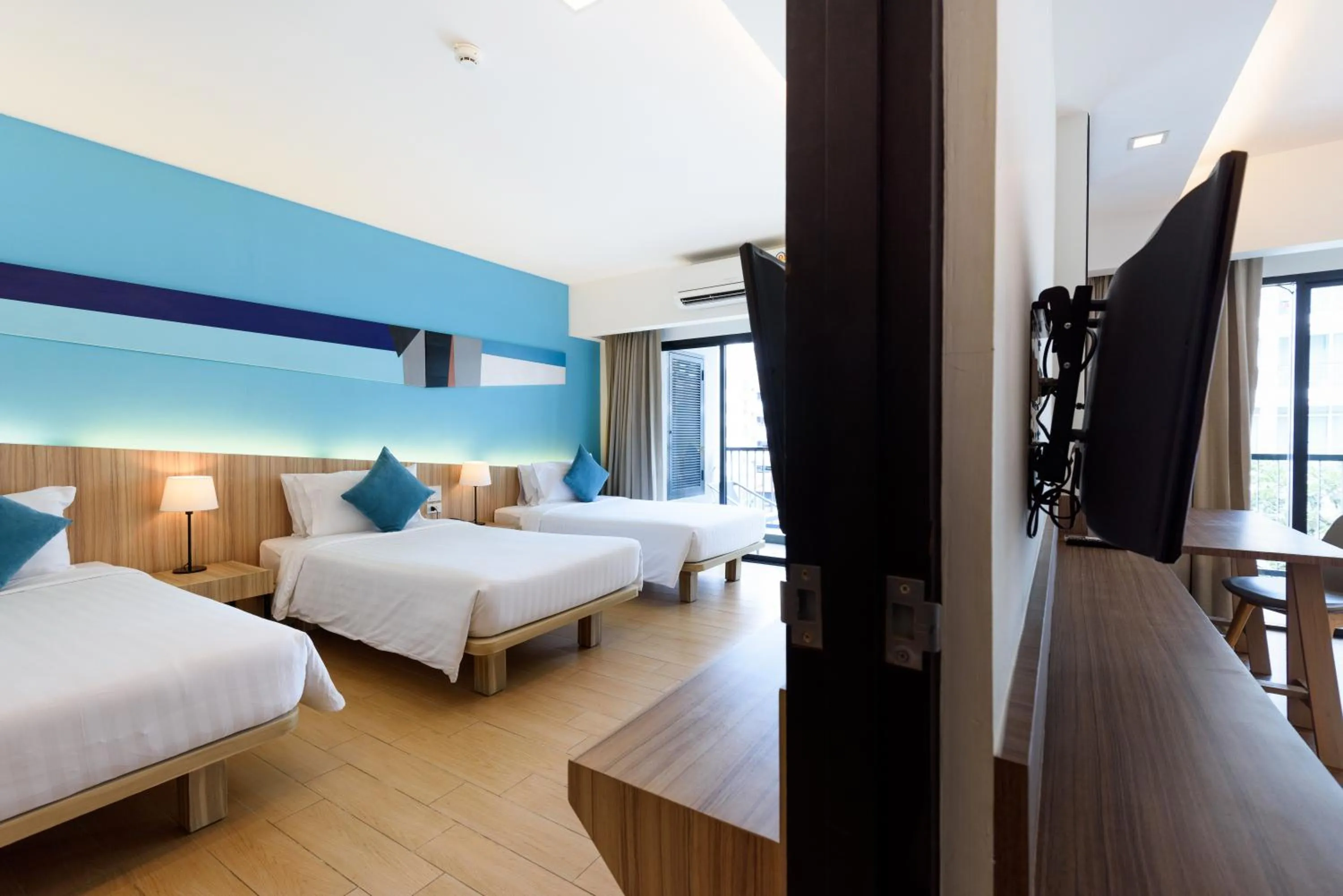 Bed in J Inspired Hotel Pattaya