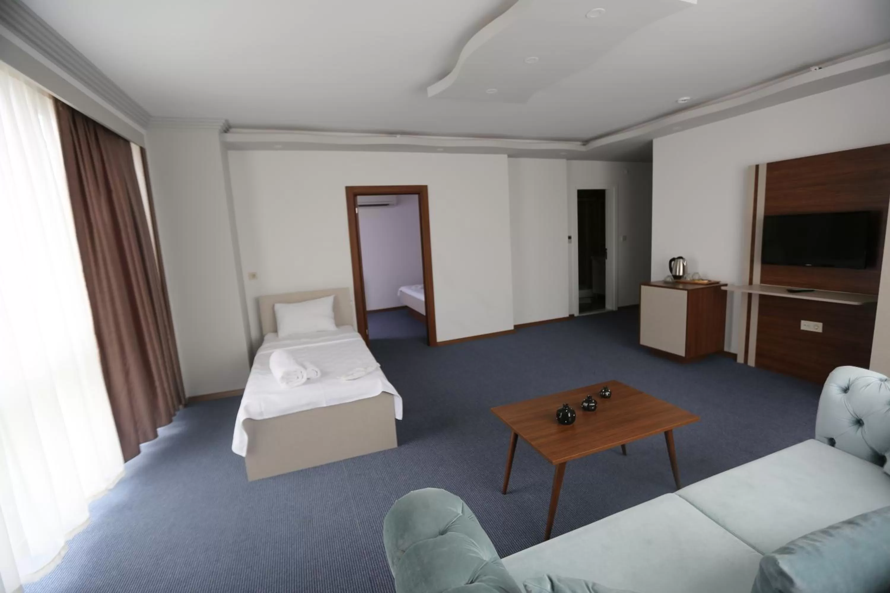 Bed in TEVETOGLU HOTEL